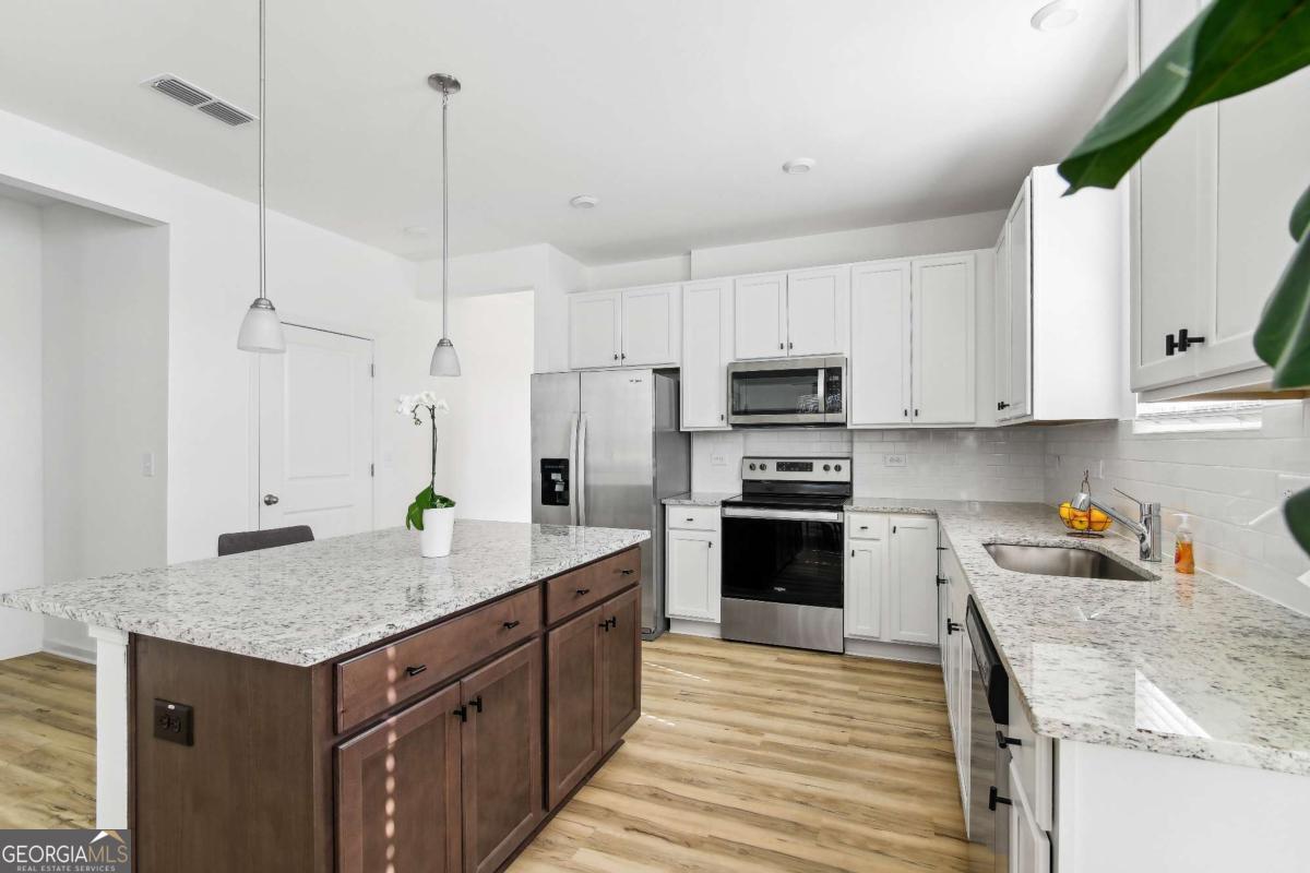 ***SIX WEEK RENT CONCESSION!*** This new-construction single-story townhome is just waiting for you to make a new start. Luxe finishes, an open floor plan, flowing natural light, and a spacious primary suite are the anchor features of this home, complemented by two secondary bedrooms perfect for family, guests, or additional living space like a home office or more. Don't miss your private attached two-car garage and semi-private spacious backyard. All landscaping is included and we've got you covered with a professional management and maintenance team at the ready, giving you peace of mind that you and your home are taken care of. This gated community is nestled in the back of a quiet master-planned community, so you can enjoy the community amenities including a pool playground, and more.