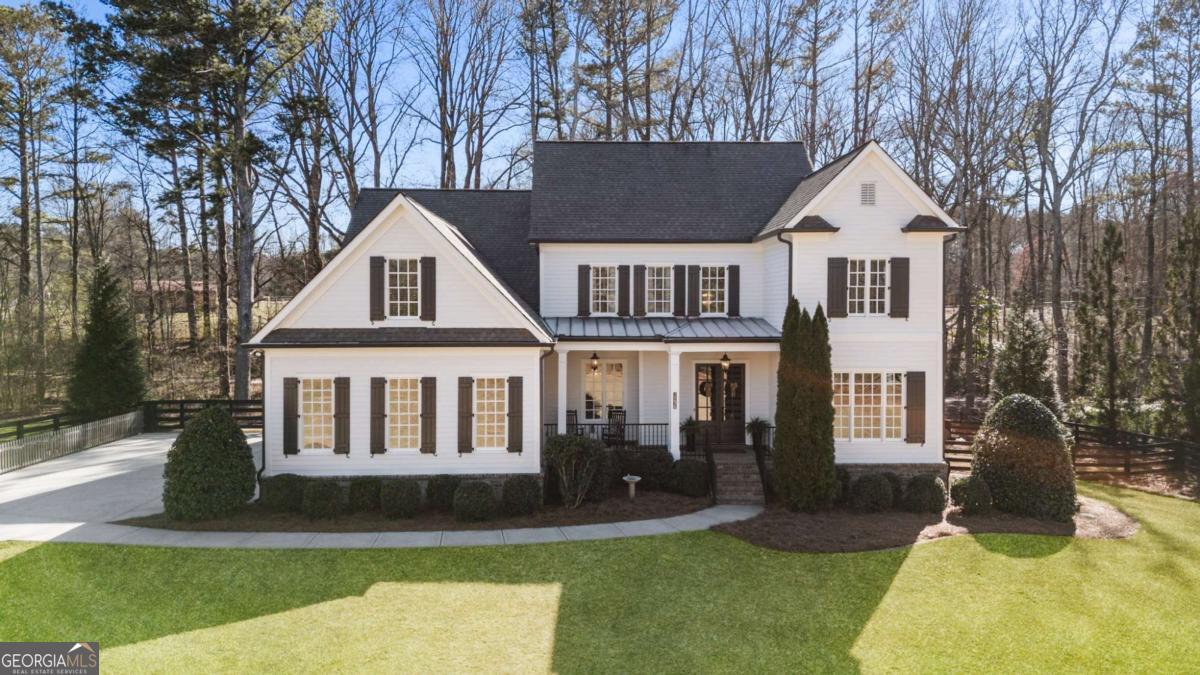 Nestled on one acre in a private, three home enclave, this modern farmhouse provides a welcoming atmosphere with an open-concept layout, perfect for entertaining. The spacious kitchen and large pantry will give you plenty of room to cook and host gatherings, and you will have room for everyone with 6 bedrooms and 6.5 bathrooms. The primary bedroom is located on the main floor - with brand new hardwood floors - and a large en-suite. Upstairs, you'll find four additional bedrooms and three bathrooms, along with roughly 1000 square feet of unfinished walk in attic space. On the terrace level, you'll find a bedroom and bathroom, office, gym or school room, living room, and theatre. Step outside to your own backyard retreat, where you'll find a refreshing pool and relaxing spa. Top-rated Milton schools, convenient access to shopping and dining, and a tranquil setting make this your dream come true. All new hardwoods on main and paint inside and out make this home better than new!