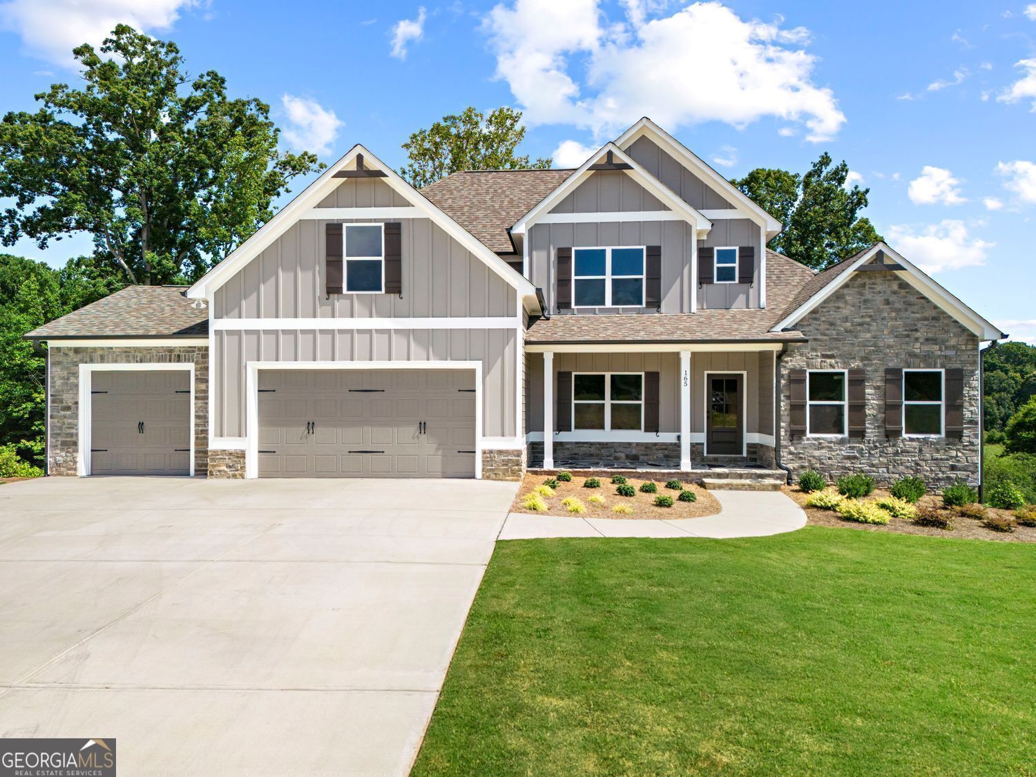 "The Oak'- Welcome home to this beautifully crafted easy living Owner suite on main home located inside the new sought after Randolph Farms. This well appointed home features: a bright, open gourmet kitchen w/ a grand island. farmhouse sink, walk-in pantry with designer shelving, Stainless steel appliances, Beautifully designed soft close cabinets and countertops throughout, Formal dining with coffered ceiling. Family room with elevated ceiling and fireplace. The private large Owners suite comes fit with a stunning large designer tile shower, double vanity, incredible tile flooring and walk-in closet. Upstairs features: 3 Secondary bedrooms with 2 full baths, walk-in closets and oversized bonus room perfect for any activity, Additional features: laundry room with attached mud room and bench on main floor, covered rocking chair front porch, Large covered rear deck perfect for relaxing and entertaining, 3 -car garage with ample parking space, Full Daylight Basement tankless water heater, irrigation system all located on a professionally landscaped level 1/2 acre lot. We have additional homesites and floorplans.