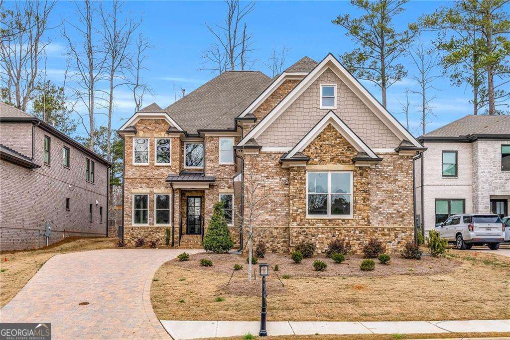 Don't Miss Out on This Stunning East Cobb Custom Home! Step into luxury with this move-in ready masterpiece, nestled in the heart of the East Side, Dodgen, and Walton school district. This gorgeous home offers the perfect blend of comfort and elegance, just minutes from The Avenues' top-tier dining, shopping, and entertainment, and with quick access to I-75. From the moment you enter, you're greeted by a welcoming office/library and a refined formal dining area. The heart of the home features a warm, expansive open-concept living space with a chef's dream kitchen and a separate prep kitchen, ideal for entertaining in style. High-end stainless steel appliances, dual laundry rooms, two patios (including a covered one with gas line hookup), and a cozy backyard enhance everyday living. Upstairs boasts three spacious bedrooms, each with en-suites and walk-in closets, a loft for quiet family moments, a media-ready bonus room, and a luxurious owner's suite complete with a spa bath, huge closet, and a private flex space. The insulated 3-car garage, prepped for electric vehicles and even a gamer's lounge, is the cherry on top. Every detail has been thoughtfully curated for a luxurious, convenient lifestyle. Lease and lease-purchase options available-your dream home awaits!