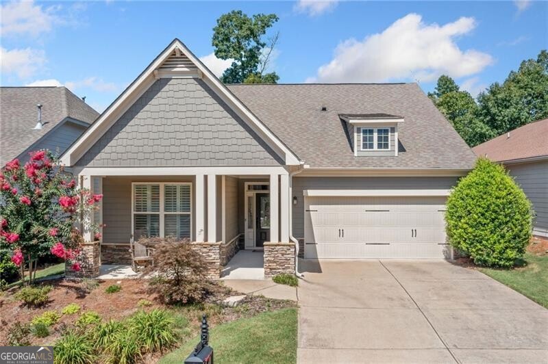 Nestled on the fifth hole of the golf course, this beautifully maintained Emerson model offers 1,825 sq ft of single level living in one of the area's most sought-after active adult communities. The home features a spacious primary suite with an en-suite bath, a private guest bedroom and full guest bath, an open-concept living and dining area, and a well-appointed island kitchen-perfect for entertaining. Additional highlights include an attached garage, a new water heater (installed 6 months ago), and updated carpeting (2 years old). Located within a vibrant 500-acre master-planned community, residents enjoy resort-style amenities including a 30,000 sq ft clubhouse, indoor pool, racquet club with a certified tennis and pickleball pro, and a full-time fitness instructor. Two on-site activities directors coordinate a wide range of clubs and events to suit every interest-billiards, cooking, gardening, arts and crafts, book clubs, games, bocce, cornhole, and more. Whether you're enjoying serene golf course views at home or exploring the endless community activities, this move-in-ready home offers the ideal blend of comfort, community, and active living.