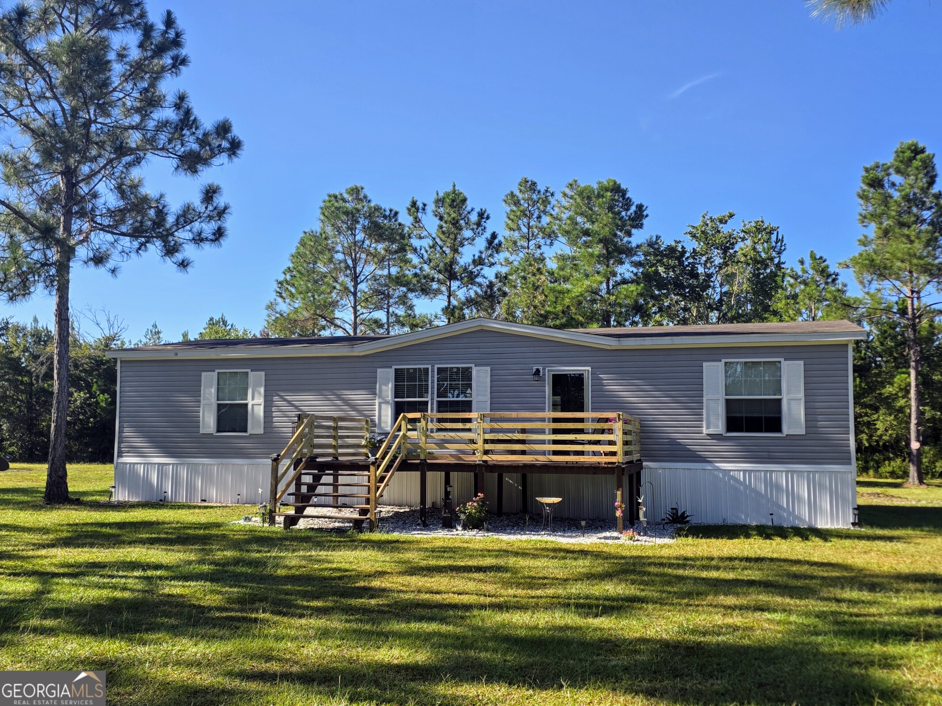 Are you tired of city life? All the noise? The traffic? The busyness? Need a little peace and quiet, some extra room, less stress? If this is true, this may be just what the doctor ordered. This DWMH is only 3 years old, and it sits on an acre just north of Folkston. Here you'll find the beauty of country life. This home has been well cared for and the rooms are spacious. Outside you have two storage buildings with electricity and A/C. The property sits on a dead-end road so the only folks driving down it are people that live here or are visiting friends or family. Priced to sell and waiting on a new owner. Come see for yourself and you'll wonder why you waited so long.
