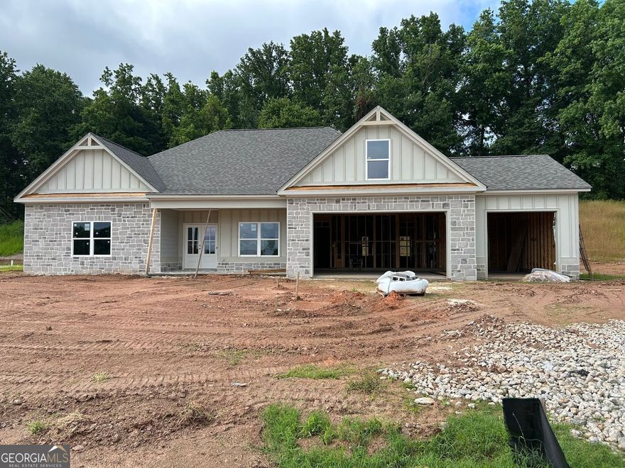 "The Black Walnut'- Welcome home to this beautifully crafted True Ranch home located inside the new sought after Randolph Farms. This well-appointed home features: a bright, open gourmet kitchen w/ a grand island. farmhouse sink, walk-in pantry with designer shelving, Stainless steel appliances, beautifully designed soft close cabinets and countertops throughout, Formal dining with coffered ceiling. Family room with elevated ceiling and fireplace. The private large Owners suite comes fit with a stunning large designer tile shower, double vanity, incredible tile flooring and walk-in closet. Two additional bedrooms and one full bath, one half bath on the main. Additional features: laundry room with attached mud room and bench on main floor, covered rocking chair front porch, Large covered rear patio with outdoor fireplace perfect for relaxing and entertaining, 3 -car garage with ample parking space, tankless water heater, irrigation system all located on a professionally landscaped 1/2-acre lot. Home will be ready late Summer
