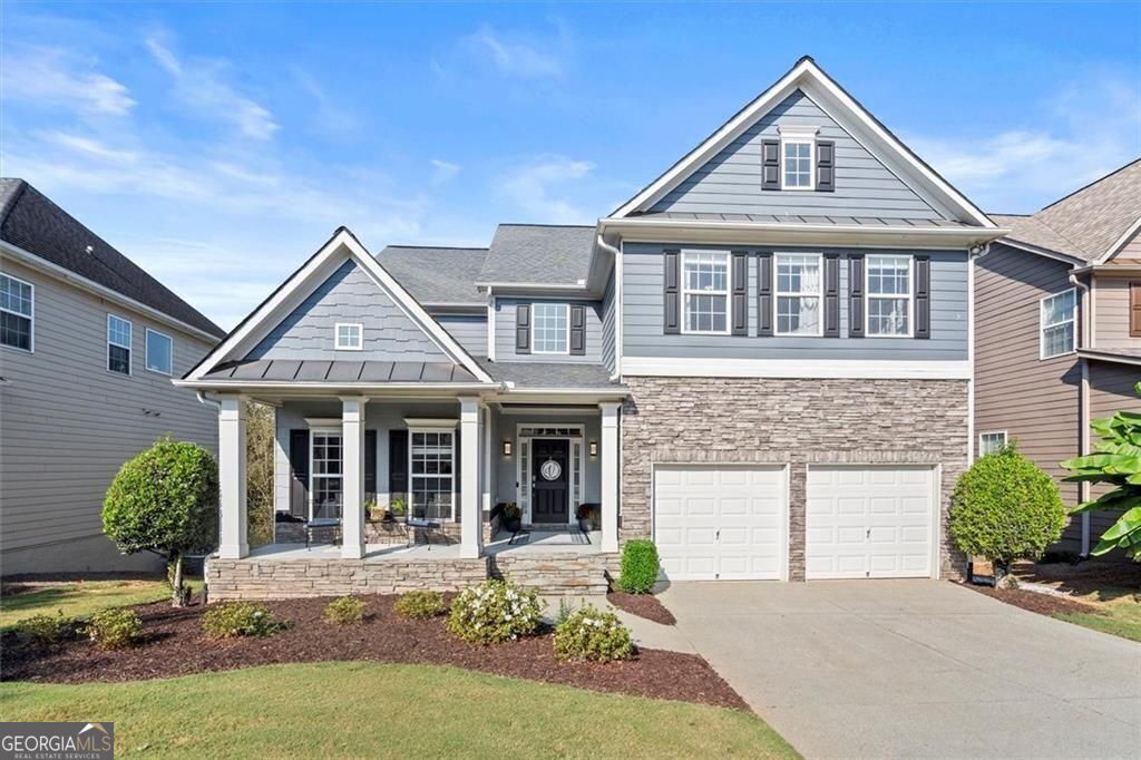 Lakefront Living Meets Creative Energy! Nestled in the heart of sought-after downtown Crabapple in Milton, GA this exceptional lakefront home blends artistry, influence & luxury in perfect harmony. Just a short sidewalk stroll to top-rated schools, boutique shops & acclaimed restaurants, this is more than a home, it's a lifestyle! Perched on a scenic lakefront lot w/jaw-dropping sunset views, the home offers the rare combination of tranquility & convenience. And here's where it gets even more exciting...the fully finished terrace level features a professionally designed, soundproof recording studio, ideal for musicians, podcasters, streamers, or anyone w/a creative spark. From peaceful mornings by the water to inspired evenings in the studio, this home supports both serenity & creativity. Main Level=Light, Flow & Function! A classic rocking-chair front porch welcomes you home. Step into the 2-story foyer, flooded w/natural light & immediately feel the spaciousness this home offers. To the left, a vaulted formal dining room features chair rail molding & French doors, making it ideal as a dining space or a private home office. Entertain w/ease using the butler's pantry, perfect as a coffee station or cocktail bar. The kitchen is both stylish and highly functional, featuring, abundant cabinetry, stone tile backsplash, stainless steel appliances (double ovens, stovetop, dishwasher), breakfast bar & a movable island for added flexibility. The adjoining casual dining area boasts uninterrupted lake views that are unforgettable. A double-sided fireplace adds ambiance to both the kitchen & the expansive living room, which features a wall of windows overlooking the lake, elegant crown molding, warm, inviting atmosphere, perfect for cozy nights by the fire. Upper Level=Private Comfort! Upstairs, the primary suite is a true retreat w/a spacious sitting room, stunning lake views, an oversized walk-in closet w/custom built-ins custom designed by Artisan Custom Closets, a luxurious en-suite w/double vanities, garden tub & separate shower. 2 secondary bedrooms share a Jack-and-Jill bath, while a 4th bedroom enjoys its own private en-suite. The laundry room is also conveniently located on this upper level. Terrace Level=Creative Sanctuary & Entertaining Space! This is where the home truly shines. The fully finished lower level includes a bar area (w/plumbing for a future kitchenette), a bonus room w/trey ceiling, perfect for entertaining or family gatherings, a 4th full bathroom, direct walkout access to the lower patio & fenced lakefront yard. This entire lower level is a versatile space perfect for multigenerational living, a guest suite, or an in-law suite. With a private exterior entrance, full bathroom & a bar area already plumbed for a future kitchenette, it offers an easy conversion to a fully independent living space. Whether for family, long-term guests, or rental potential, the flexibility is unmatched. Tucked just around the corner is the star of the show, a 5th bedroom professionally converted into a world-class recording studio, complete w/industry-level soundproofing. Whether you're producing music, hosting a podcast, or creating video content, this space is ready to support your vision. Outdoor Living & Community Amenities: The rear yard is fully fenced, w/gate access to the lake. Enjoy outdoor living from both the upper porch & lower patio, perfect for morning coffee, al fresco dining, or soaking in the views. Located in Waterside, a beloved community of 279 homes built around 2 lakes, residents enjoy resort-style amenities including a clubhouse, large pool, two lighted tennis courts, basketball court, playground, walking trails & beautiful green spaces. Situated less than a mile from 3 of GA's top-ranked schools, Milton High, Northwestern Middle & Crabapple Crossing Elementary-this location offers both prestige & peace of mind. Milton was ranked #1 in GA for quality of life + #9 in the southern US according to Business Journal