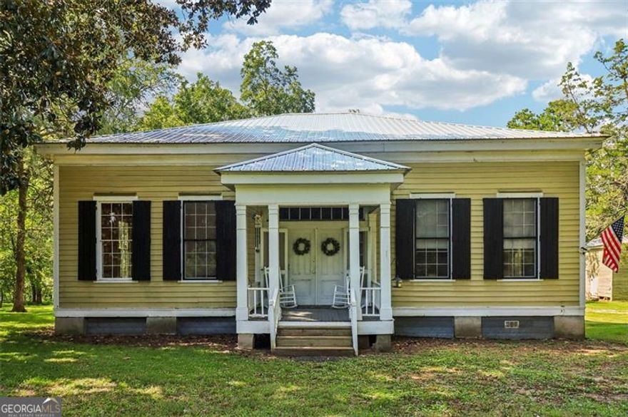 Step back in time with this stately 1800s Southern farmhouse on 5 acres, with an additional 15 acres available. This isn't just a house; it's a piece of history where timeless character meets modern comfort.  Inside, you'll find original heart pine floors, 14 ft ceilings, and beautiful windows, creating a sense of grandeur and space. The rocking chair front porch invites you to slow down and enjoy the simple pleasures of country living.  This home has been lovingly updated for today's lifestyle, boasting a brand-new metal roof, updated HVAC, and beautifully renovated kitchen and baths, including a clawfoot tub for soaking up the peaceful vibes.  Located on a quiet dirt road just off Hwy 129, the property offers several acres of green pasture, pecan grove, and mature hardwoods. You'll feel a world away, yet you're just a quick drive from Macon, Gray, Eatonton, Milledgeville, and Lake Sinclair.   If you've been searching for a historic farmhouse that offers space, beauty, and versatility, this is a rare opportunity to own a piece of the past and build future dreams. Whether you want a small farm, a horse property, or even a charming venue, call today and let's make this your home. ~Cindy Smith 7064745532