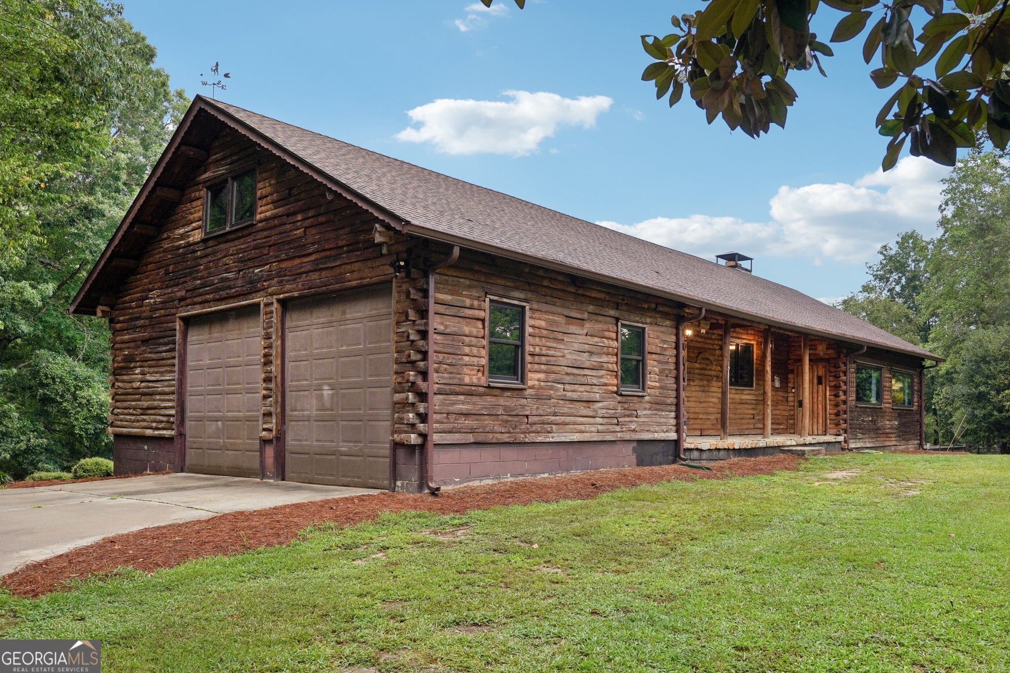 **Calling all visionaries and fixer uppers!**Professional photos to come**Come see this Spacious, Full Log Cabin with Separate Basement Apartment.** Many major renovations have been done but there is still remaining work needed. Built in 1972 by Ward Log Homes, this Cedar Cabin in Full of Charm. Upon entering the home, you will appreciate the feeling of being on Vacation. This 5-bedroom, 3-bath Cabin is packed with potential and waiting for your personal touch. Yes, it needs work-but with Solid Bones, Unique Features, and a One-of-a-Kind setting that includes a Private Pond (full of bass, bream and crappie) and Pebbletec Saltwater Pool, this home offers an Incredible Opportunity for those willing to invest in some TLC. As you walk in the front door, you will be delighted to see the Gorgeous, two-story family room with Beautiful Beams and a Massive Wood Burning Fireplace that is made of Natural Stones from the property. The Chefs Kitchen offers Black Stainless Appliances to include a Double Oven, Large Gas Cooktop, Large Fridge and a Porcelain Farmhouse Apron Sink. The main level features two bedrooms and two full baths. The upper level offers one bedroom and a Cozy Loft Area that overlooks the Beautiful two-story family room. The Sunroom/Dining Room offers a beautiful Panoramic View of the Pool and Pond and will surely be your favorite spot in the Cabin! But the real gem is the Fully Finished Walk-Out Basement-its own Private Living Space complete with a Full Kitchen, Living Room with a Masonry-Fireplace, two bedrooms, a full bath, and a Separate Entrance and Driveway. Whether you're considering an AirBNB, In-law Suite, or Multi-Generational Living, the layout is ideal and has great income producing potential!