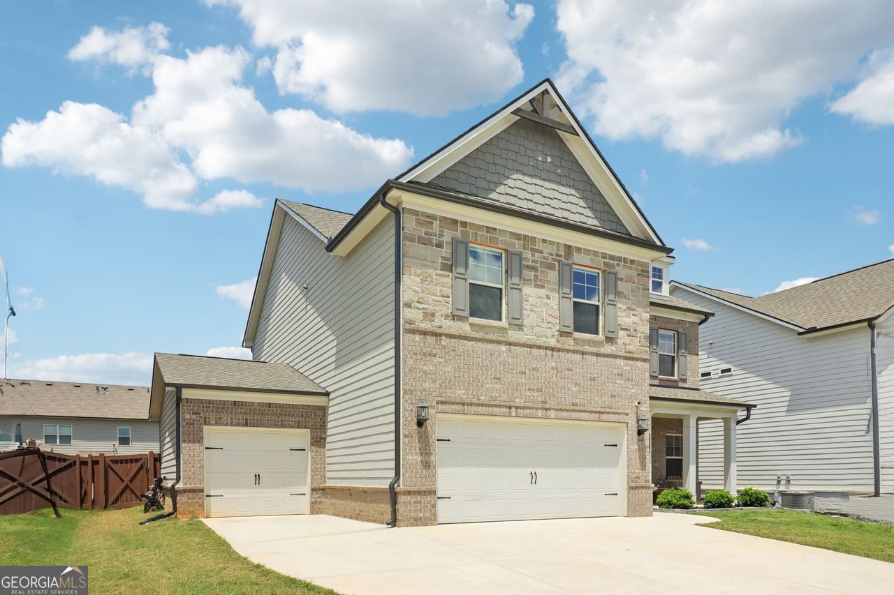 Welcome home to refined living in Central Park, one of Loganville's most desirable communities! This beautifully appointed 5-bedroom, 4-bath home combines elegance, functionality, and space for everyone. On the main level, you'll find a private guest suite with a full en-suite bath-perfect for visitors or multi-generational living-as well as a versatile enclosed office that can flex as a playroom, library, or formal sitting area. The heart of the home is the chef's kitchen, boasting granite countertops, ceramic tile backsplash, stainless steel appliances, and a walk-in pantry. Enjoy meals in the light-filled breakfast room accented with crown molding, chair rails, and shadow box trim. The adjacent mudroom with custom beadboard and hooks adds everyday charm and convenience. Upstairs, a spacious loft with custom built-ins offers the perfect secondary living space, while the oversized bedrooms and well-appointed baths ensure comfort and privacy. Outside, a professionally landscaped, fenced backyard creates an ideal space for entertaining, pets, or play. Additional highlights include a three-car garage, sidewalks throughout the neighborhood, and access to a community pool and park-offering the perfect blend of luxury and lifestyle. Don't miss this exceptional opportunity to own a home that truly checks every box!