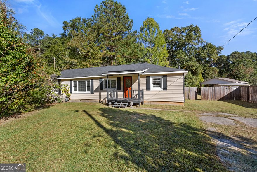 Welcome home to this updated and move-in ready 3-bedroom, 1-bath ranch nestled on a half-acre fenced lot-just minutes from both Downtown Marietta and Smyrna!    Step inside to find a bright, open-concept layout with laminate flooring throughout and large windows that fill the home with natural light. The kitchen features painted cabinets and plenty of counter space for meal prep and entertaining.    The spacious living area flows effortlessly to the covered back deck, the perfect spot for morning coffee or weekend gatherings. The expansive, flat backyard offers endless possibilities-garden, play area, or even an outdoor fire pit lounge.    Recent upgrades provide peace of mind, including:   New septic tank & field lines   New water heater   New windows   Newer HVAC system    There's even a converted backyard shed with bar setup, ideal for entertaining or transforming into a creative studio or workspace.    Enjoy the convenience of nearby parks, shopping, dining, and easy access to I-75. Whether you're a first-time buyer, investor, or downsizer, this charming ranch offers comfort, value, and room to grow.     Don't miss your chance to make 2730 Hembree Rd your new address! Schedule your tour today.