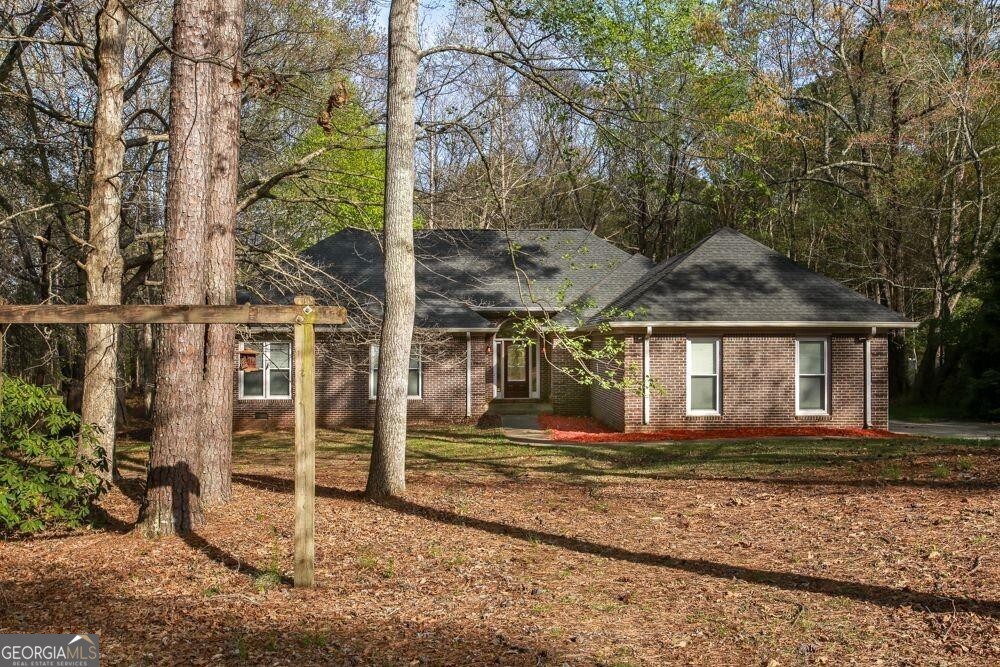 This home showcases a comprehensive renovation completed in 2020, featuring a 250 sq ft upstairs addition, a fairly new roof, and extensive kitchen and bathroom updates. The main level accommodates four spacious bedrooms, and an upstairs flex room offers flexibility for various uses, such as a home office, theater, or guest retreat. The inviting split-foyer layout, expansive living areas, and abundance of natural light create a warm atmosphere, particularly with the large deck overlooking a private lot lined with mature trees. Situated in a peaceful Carrollton neighborhood near Lake Carroll, the GreenBelt and downtown, this home seamlessly blends modern amenities with timeless charm. Located in the Windemere Subdivision, this charming ranch is close to local amenities, including a short walk to the Greenbelt, 3 miles from Carrollton Square, and 1 mile from the bypass and Hwy 61. Key features of this property include a spacious family room, hardwood floors, a large backyard, a 2-car garage, a master suite with a vaulted ceiling, a tub and shower, a breakfast nook off the kitchen, an island, double ovens, a large laundry room, and a pantry. Home needs a little TLC and priced as such. The property is sold as-is. Seller is Motivated.