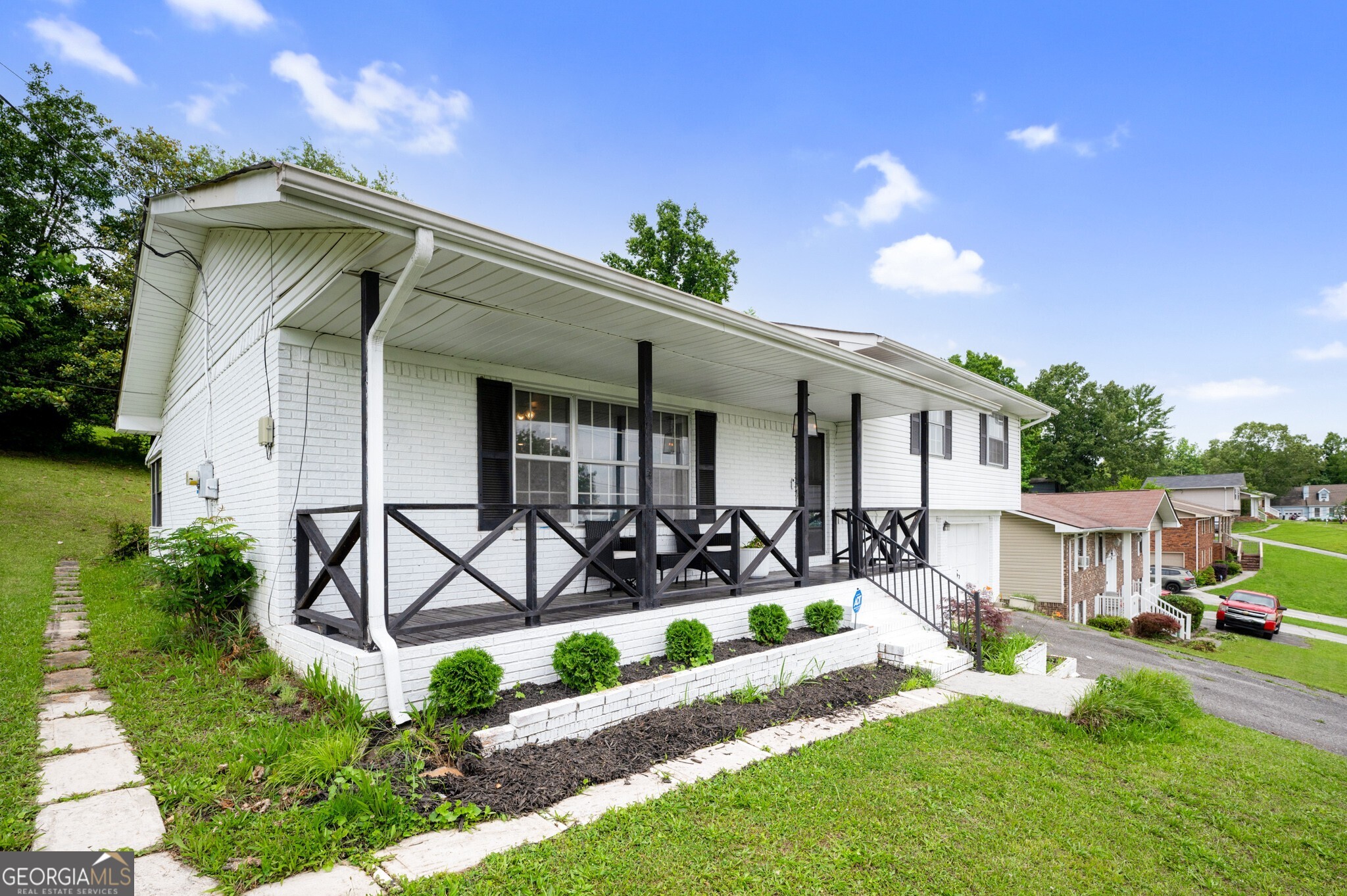 Come home to 1717 E Rebel Rd where you have front porch views for days but are only 15 minutes from downtown Chattanooga! This 3 bed, 2 bath split level home offers spacious open plan living indoors as well as inviting yard and porch options to enjoy the outdoors. Inside, enjoy over 1700 square feet of living, dining, and sleeping space updated with fresh paint that makes the rooms feel clean and bright. Outside, choose between the front porch - you can sit outside and enjoy long range views of the hills far away - or the grassy backyard with sunroom access for year round relaxation. Consider this your chance to live near a bustling town but once you're home, feel like you're miles above it all. All information deemed reliable but should be confirmed by buyer.