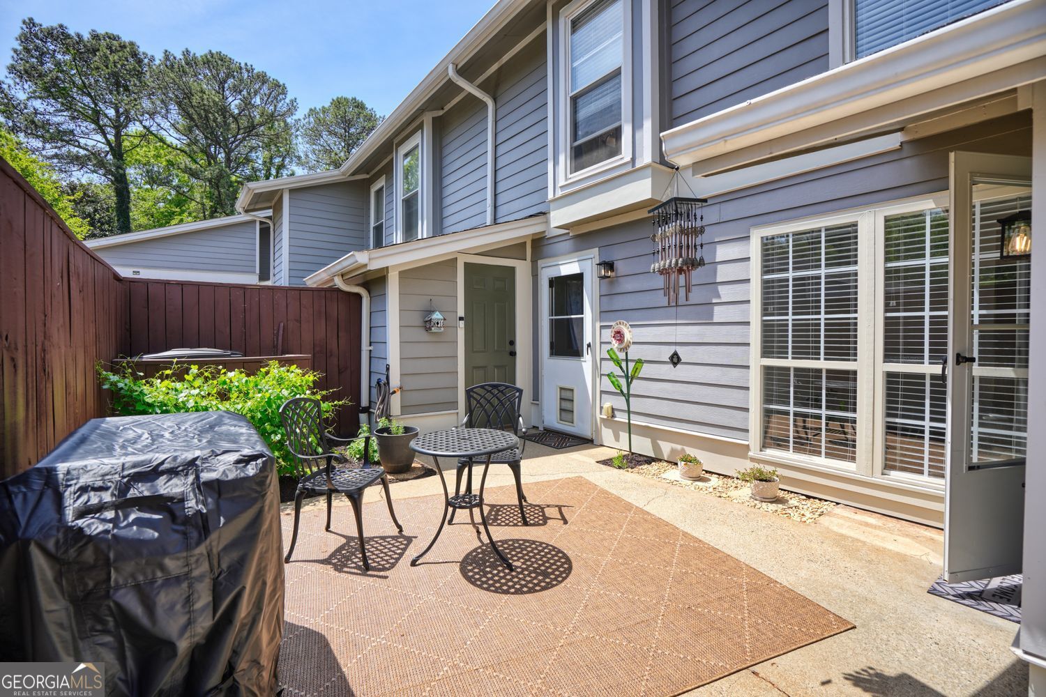 Welcome home to your spacious 2 bedroom, 2.5 bathroom East Cobb condo with not one, but two outdoor living spaces, in top-rated Cobb County (Walton High School) school district! When walking up to the home, you are greeted by a large outdoor patio with room to garden and gather. The main level consists of the kitchen with freshly painted cabinets, separate space for dining and ample living space to unwind at the end of the day. The half bathroom and laundry are conveniently located on the main floor. The upstairs has two large bedrooms, each with full bathrooms attached, the perfect roommate floorplan. This condo has been thoughtfully updated with fresh paint, updated lighting fixtures, and new bathroom vanities. The community has a beautiful pool to enjoy in the summertime as well as tennis and pickleball courts to be enjoyed year-round. An added bonus for pet lovers, this community is extremely pet-friendly as is the home itself with ample outdoor spaces for your animals to enjoy. This home is districted for Walton High School, regularly ranked in the top ten (currently #6) best high schools in the state of Georgia. In addition to the fantastic schools, the location of this East Cobb home can't be beat given its plethora of parks, stores, restaurants and all that Marietta has to offer, including Marietta Square, just minutes away. Easily access Interstate 75 to zip to different parts of the city. Book your private tour today!