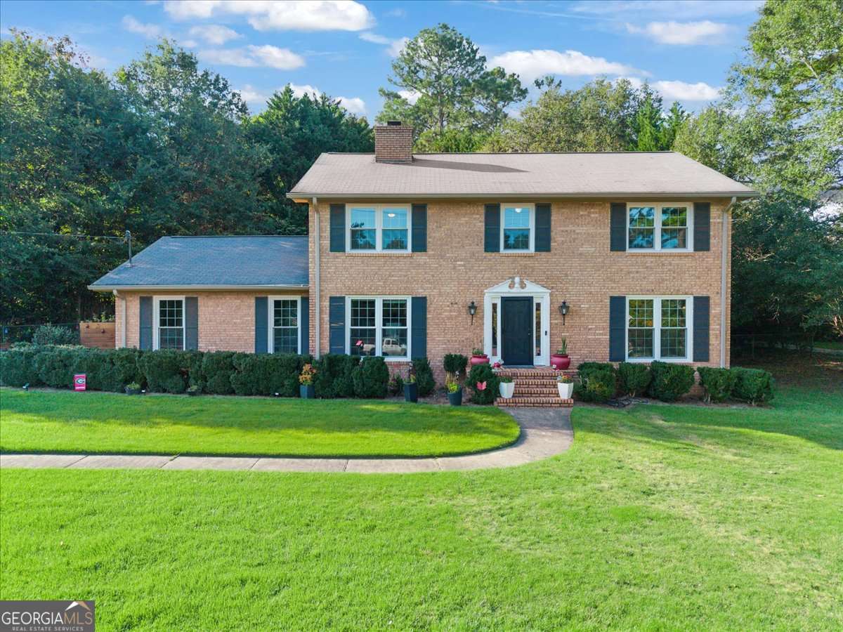 Welcome to 200 Clifton Drive in Homewood Hills subdivision in Athens! This charming home offers a perfect blend of character and modern updates. Step inside to find gleaming hardwood floors, a beautifully updated kitchen, and recently renovated bathrooms designed for today's lifestyle. Natural light pours through the NEW WINDOWS, creating a warm and inviting atmosphere throughout. Outdoors, you'll love the thoughtfully designed landscaping with raised garden beds, vibrant flower gardens, and plenty of space to enjoy the seasons. Whether you're entertaining friends or simply relaxing at home, this property offers comfort, charm, and convenience in a desirable Athens location.