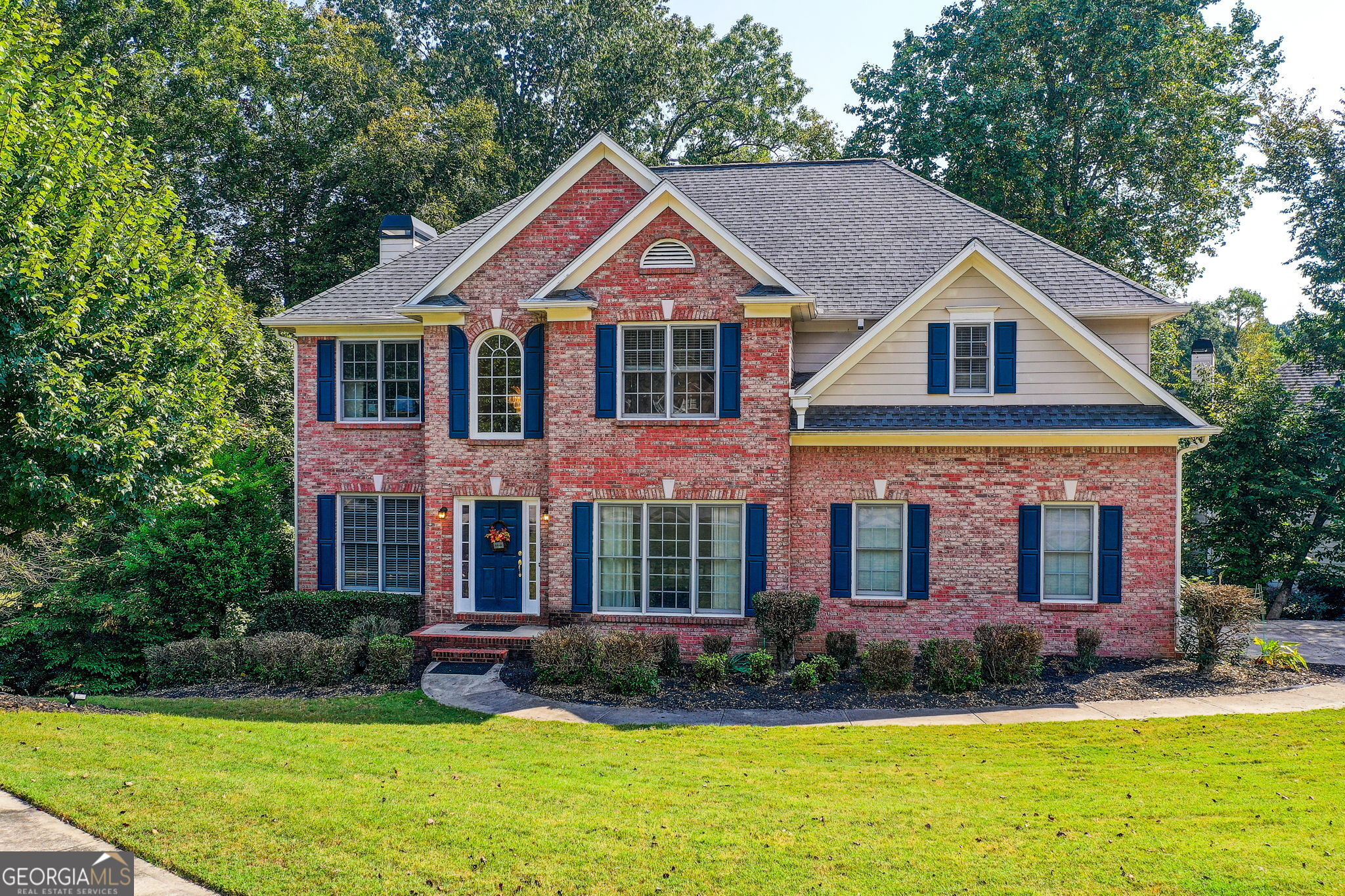 Welcome to this spacious 6-bedroom, 4-bath home in the sought-after Hamilton Mill community. With nearly 4,800 square feet of living space, including a fully finished basement, this property offers room to spread out while enjoying thoughtful design and modern finishes. The main level features an inviting living room with a cozy fireplace, flowing seamlessly into the gourmet kitchen. Granite counters, stainless steel appliances, a gas range, and double ovens make cooking a delight, while the large back deck is perfect for dining outdoors and enjoying the wooded view with a creek towards the back of the property. Upstairs, the primary suite provides a true retreat with a soaking tub, separate shower, and generous closet space. Additional bedrooms are equally comfortable, giving everyone plenty of room. The fully finished basement adds even more living space with a full bedroom, full bath, and flexible areas ideal for a media room, playroom, or guest suite. Set on a wooded lot, this home combines privacy with access to Hamilton Mill amenities. Community pools, tennis, golf, and nearby shopping and schools make this an ideal choice for those seeking both comfort and convenience.