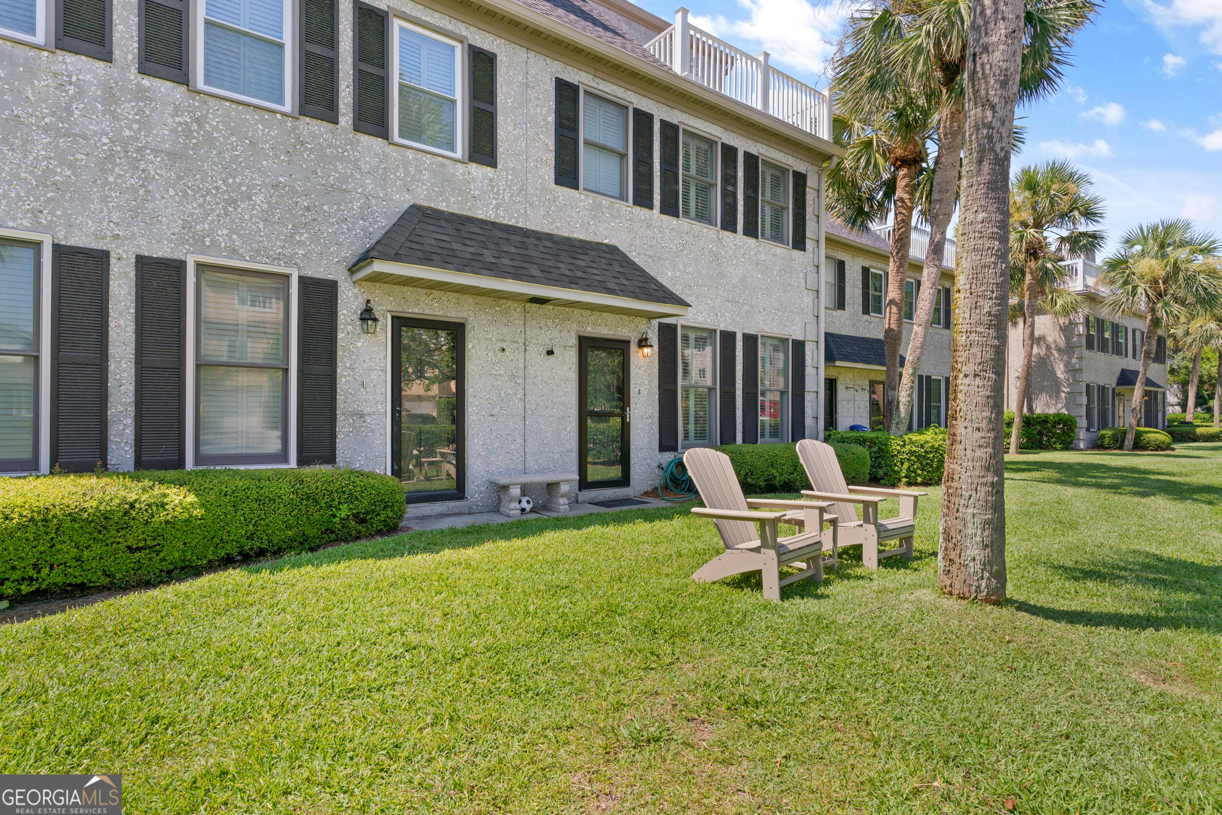 Breathtaking Atlantic views!! from Saint Simons Island's sandy shores. Stunning ocean views from all three levels of this renovated home. Walk right in - no steps. Kitchen upgrades include; granite countertops, farmer sink, island with sink and free standing ice maker, pantry, newer stainless steel appliances, penny round silver stainless steel backsplash, newer cabinetry, and a separate bar sink. The main level has high ceilings with fireplace and built in's and plenty of storage space, porcelain wood look tile floor throughout and all newer impact Anderson 400 series windows. Owners suite on third floor and has unobstructed view of the ocean and a large walk in closet with a custom cabinet system and a large en-suite bathroom. The third floor sun deck was recently totally renovated. The second level has two bedrooms with one having views of the ocean and an en-suite bath and another bedroom and bath. The first floor has an open concept kitchen, eating area and living space. There is a whole home dehumidifier system that covers the 1st and 2nd floor and a mini-split HVAC system on the third floor with an in-wall dehumidifier. Exterior storage shed, propane grill and separate bike rack that's included. Beachcomber condos are located just one-half block from the beach with easy access from the Second Street public beach crossover or from 1st Street. 1/3 of a mile to the iconic King & Prince Beach Resort restaurant & bar. Of course, just as close to the Crab Trap & Crab Daddies Restaurants. Only 1 mile to the village & pier area w/shopping, restaurants, bars, & more. In short, this is the perfect location. Incredible location just steps to the beach access. Great vacation rental investment opportunity, no minimum rental, Sold turn key.