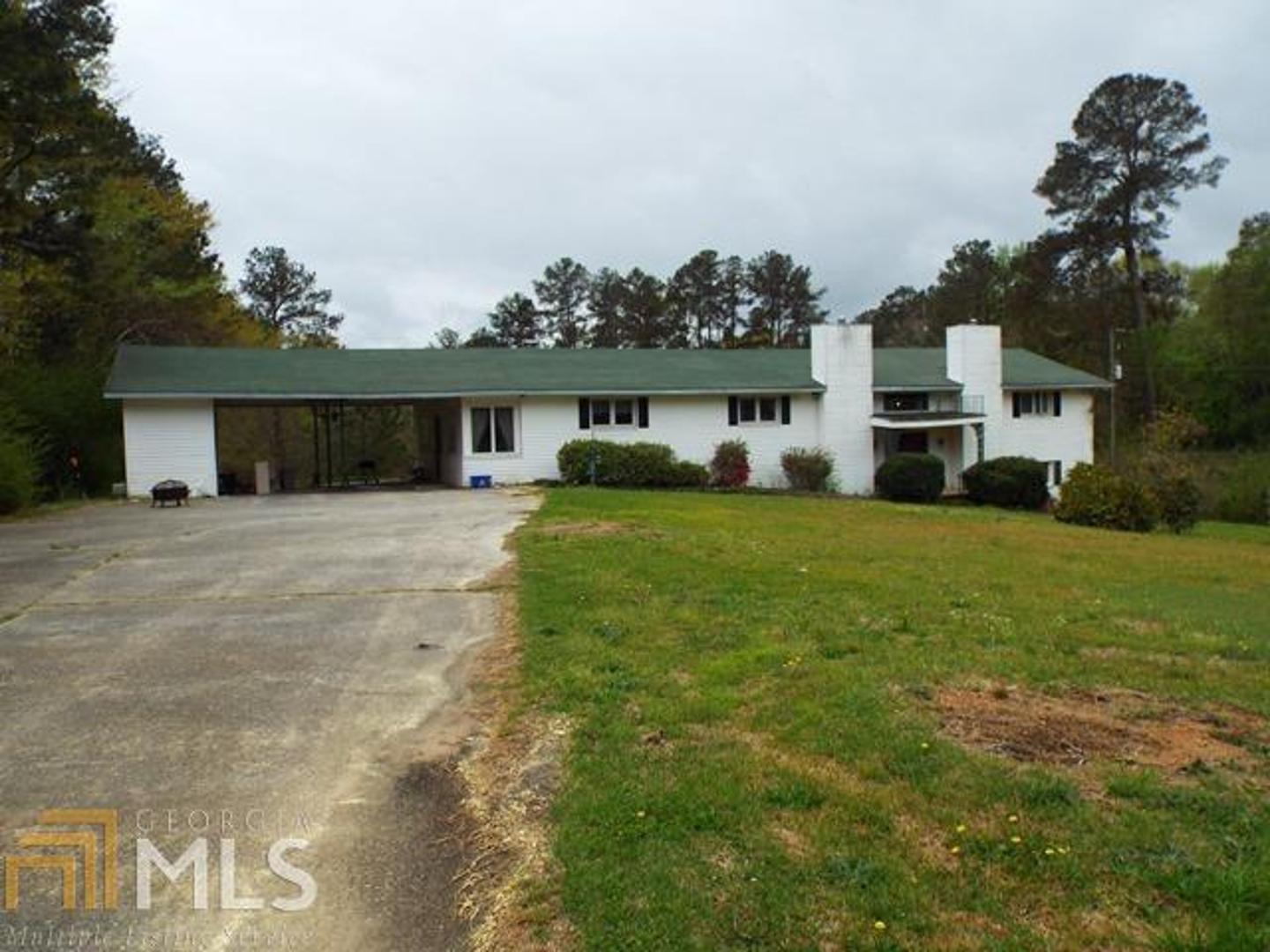 Large home need some TLC...4.9 acres with pond, tennis court (needs work) and pool (needs work) Living room with fireplace, large Den...AS IS sale.