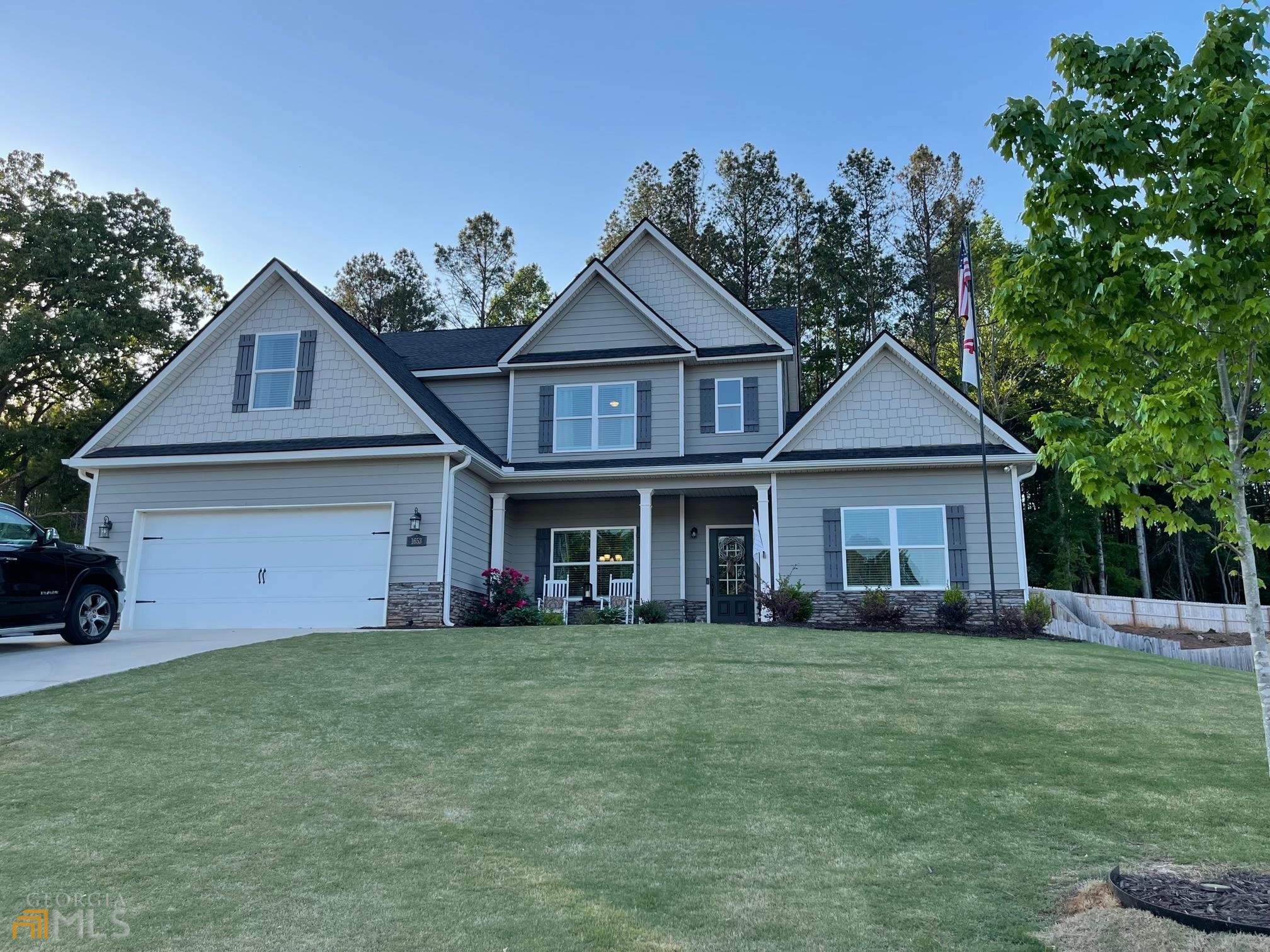 Craftsman style - Builder's "Oconee Plan" - 3 bed/2.5 bath plus an oversized bonus room. Just 2 years young. Beautifully designed with an open concept kitchen and great room. Oversized granite island provides plenty of counter workspace. Adorned with stainless steel appliances and shaker style cabinetry. Deep walk-in pantry. Plenty of ambient and task lighting. Kitchen has a keeping area perfect for extra seating. Separate formal dining room. Spacious master-on-main offers an oversized master closet inside of the master bath. Tiled shower and soaking tub. Upstairs features 2 large bedrooms plus a large bonus room that could be a 4th bed. Custom back patio was poured to be twice the size of the builder's plan. Come and enjoy the private fenced backyard under the custom pergola. Seller also had a 2-car parking area poured on the side of the house for level parking. Shown by appointment only. We are asking for at least a 2-hr notice so seller can remove pets.