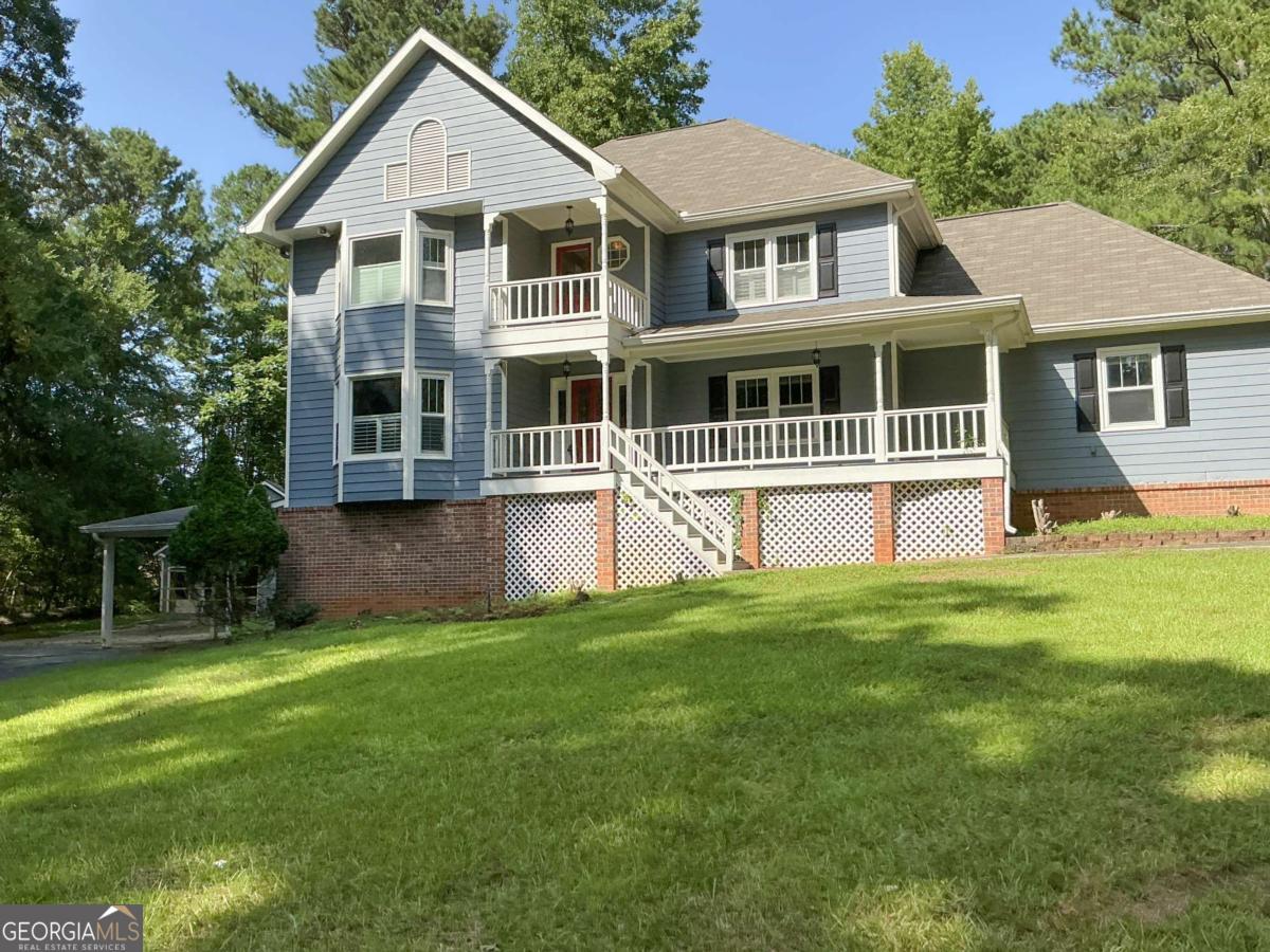 Welcome home! Nestled on 8.11 private acres, this home with a finished basement offers space, privacy, and potential. Features include a large living room with a fireplace, a separate dining room off the kitchen, and a deck with an above-ground pool that needs some TLC. There is a bedroom on the main floor with a full bath. The upstairs has a spacious owner's suite, two more bedrooms, and laundry. The basement includes a family room, full bath, possible fifth bedroom, and private entrance-great for a teen suite. No HOA. The home needs some TLC, but it will be worth the sweat and effort.