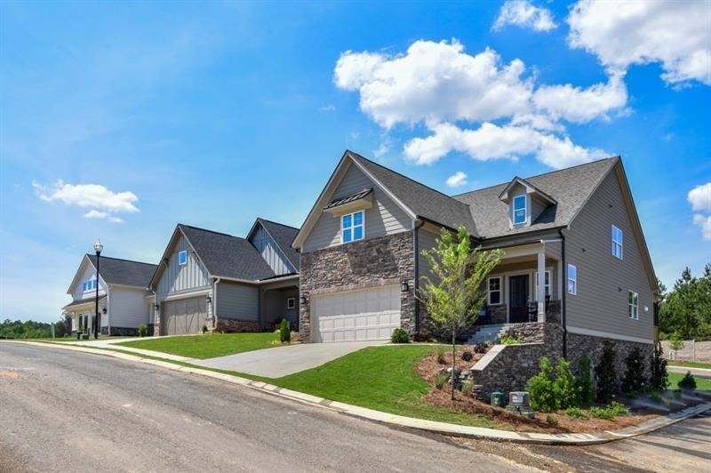 The Lennon features 2 bedroom/2 bath on main providing the ideal retreat at the end of an active day - a day filled with just a few of the activities available without leaving Grandview - walking the nature trail, swimming laps in the resort style pool or tending your tomatoes in the community garden. Enjoy an afternoon pickleball match with you new friends before a home cooked meal with the new recipes you learned in class in the demonstration kitchen in the clubhouse. After dinner enjoy a pleasant stroll around the sidewalk lined streets or relax on your optional screen porch and enjoy the fresh mountain air. Grandview is just minutes away from metro Atlanta, offering convenient access to retail, restaurants, medical and entertainment. Grandview is located in Jasper, the first mountain city, the Gateway to the North Georgia mountains. Ask about builder incentives available in October. Up to $1500 in closing cost incentives when using our preferred lender, Prosperity Home Mortgage. Buy now and finish with your preferences, including finishing loft space and additional bedrooms on the 2nd level.