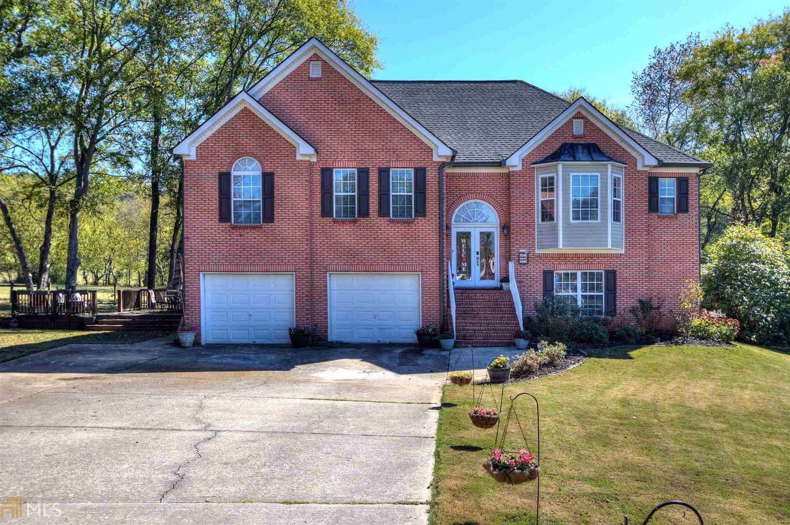 Come see this massive show stopping home! This home is like two homes in one. Upstairs, it features a spacious open floorplan with a 9 foot island, granite counter tops, SS appliances, hardwood flooring, large LR, enormous master suite with a sitting room, master bath includes a custom double vanity, beautiful tile shower, walk-in closet, spacious secondary bedrooms. Downstairs features two very large bedrooms, an open concept living room/kitchen, bath & LR. Outside you'll find a covered back deck and patio that overlooks a farm, fenced yard! Don't miss this one!