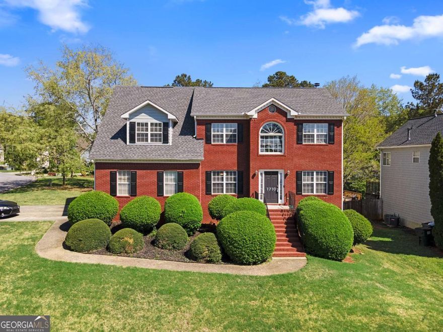 Welcome to this beautiful 4 bedroom, 2.5 bath traditional home, perfectly positioned on a large corner lot with a spacious level yard and endless potential. Inside you're greeted with a grand two story foyer that leads into a thoughtfully designed main level featuring a separate dining room, a cozy sitting room, a convenient laundry room, a half bath and at the heart of the home, you'll find a large, stunning kitchen with unique cabinetry, gorgeous quartz countertops, a breakfast bar, and a bright eating area. The kitchen overlooks a warm and inviting living room with a fireplace, perfect for both everyday living and entertaining. Upstairs, the oversized primary suite offers a true retreat, complete with his and her walk-in closets, a luxurious ensuite bathroom with double vanities, and a private sitting area or reading nook. Three additional spacious bedrooms and a full hall bath complete the upper level. Need more space? The unfinished basement offers endless possibilities. Whether you are dreaming of additional bedrooms, a game room, home gym, or office space, the opportunity is yours. With a 2 car garage, timeless curb appeal, and a fantastic layout inside and out, this home has everything you need and more.
