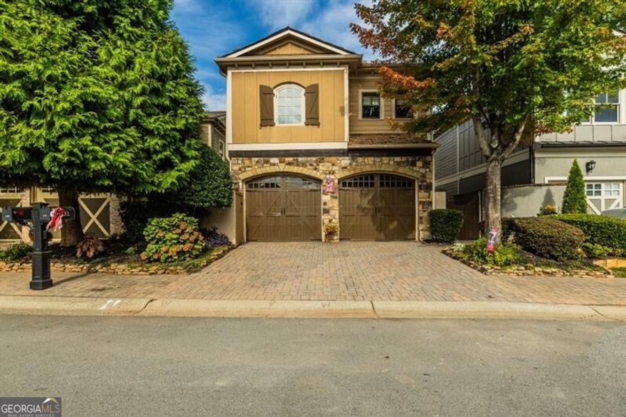 An entertainer's delight!, 1 mile from downtown Woodstock If you are looking for an expansive patio where you can have all your friends over to watch a fall football game with the covered  TV set up, fireplace roaring in the background and cafe lights setting the mood OR. a slow morning to sip your coffee in the privacy of your garden area, this house is for you! One of the few homes with a Turret style detail, the charm is undeniable. An open concept main floor has a wall of windows looking onto one of the larger patios in the community.  Character galore with detail in the shiplap fireplace, round front door in the curved entryway, engineered hardwoods  and coffered family room ceiling. The white cabinetry, stainless steep appliances and stone countertops are just another added upgrade. The upstairs landing has a wall of build in bookcases, currently an office but has loads of options. Primary suite has 2 large closets, en suite with water closet, double sink, soaking tub and separate shower. 2 additional bedrooms, full bath and laundry room to finish out the well laid out space. Close to Woodstock Park, restaurants, night life and all things Woodstock!