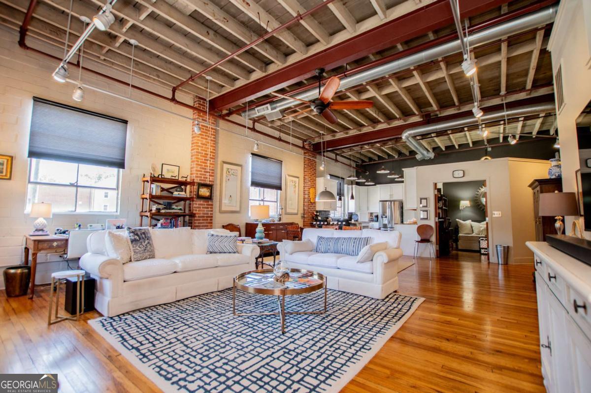 Stunning Professionally Decorated Condo-Prime Location! Step into this exquisitely styled condo that feels like it's perfect for executives, singles or downsizing seniors looking for low-maintenance luxury living. Located just a short walk from the Square, you'll lenjoy easy access to shopping, dining, The AMP and the Greenbelt- everything you need, right at your doorstep. The home includes two assigned parking spaces, and the $250/month HOA fee covers water, trash, and lighting in all communal areas, offering both convenience and value. Prepare to be impressed-this one won't last long!