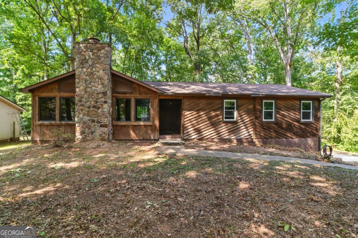 SELLER OFFERING $25K CREDIT FOR CLOSING COSTS or UPDATES WITH FULL PRICE OFFER!!! INVESTOR SPECIAL, PRICED ~$50K-$85K BELOW AREA COMPS! This 3 bed/2 bath home could be perfect for a Fix & Flip, Buy & Hold, or owner occupant looking to invest some sweat equity. Move in ready home could use minor cosmetic updates. Enter into the large living room with vaulted ceilings, fireplace, and huge windows to allow in tons of natural lighting. Kitchen offers tons of cabinets and counter top space and a separate dining room. Large Master Bedroom with walk in closet and En-suite with tub/shower combo. Two great sized secondary bedrooms and secondary bathroom providing a large vanity and tub/shower combo. The large basement provides plenty of space for future expansion. Out back the back deck overlooks the large back yard waiting on your personal touches.