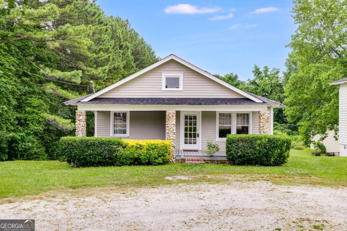 Welcome to this charming commercial property on over half an acre! Featuring a functional galley kitchen with freshly painted cabinets, new flooring in utility areas, and beautiful real hardwood floors throughout. Enjoy peace of mind with a new roof, new HVAC system, and a 5-year-old water heater. This cozy space offers the perfect blend of vintage character and modern updates. The expansive yard provides ample space for various business activities, from gardening to outdoor events. Don't miss this opportunity to own a versatile property with so much to offer. Must see! Sold as is.