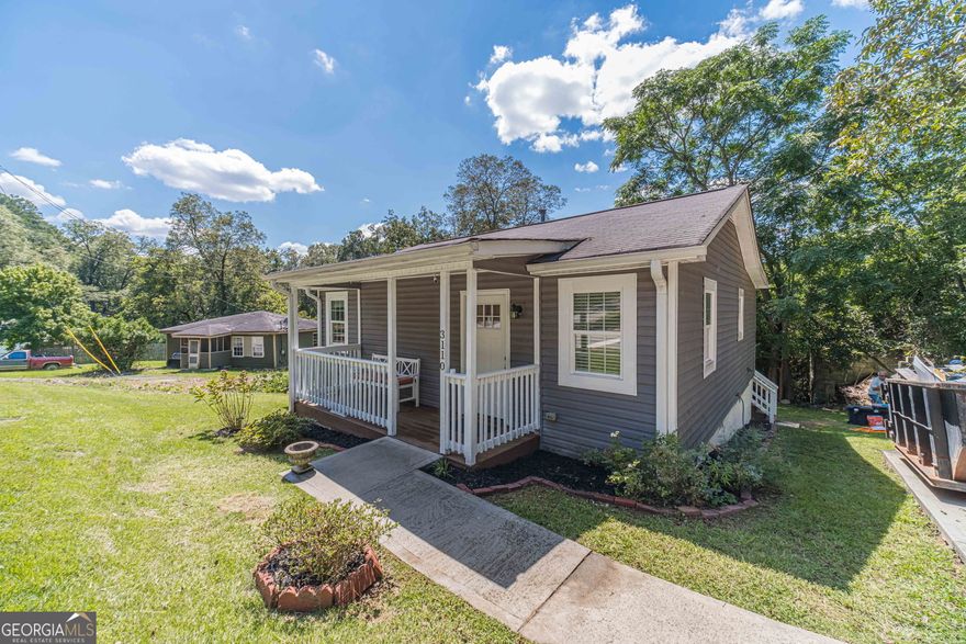 5.5% or Lower Interest Rate for Year 1 with Preferred Lender.  Welcome to 3110 Emory Street, a charming 2-bedroom, 1-bath home just minutes from historic downtown Covington's popular shopping and dining district. This beautifully updated residence features an open floorplan with gleaming hardwood floors, fresh interior paint, and a stylish kitchen complete with granite countertops, stained cabinetry, and stainless steel appliances. The bathroom offers a classic tub/shower combination with tile surround, while the inviting rocking chair front porch provides the perfect spot to relax and enjoy the neighborhood. With its blend of character and modern updates, this home is move-in ready and ideally located near all that Covington has to offer. Some restrictions apply on lower interest rate.
