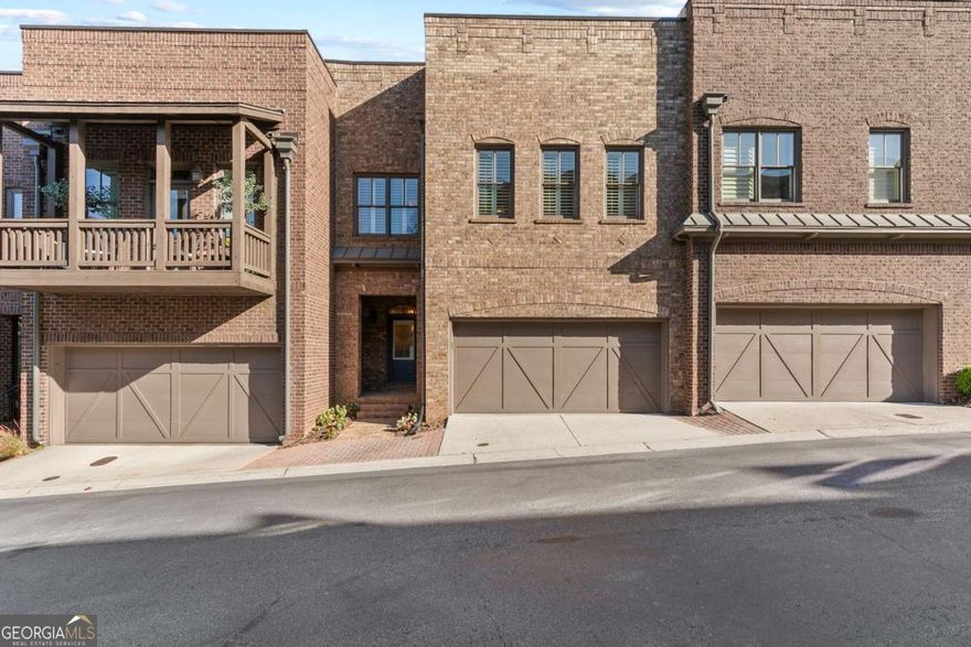 Welcome to the best of Roswell-Canton Street living at it's finest! Beautiful brownstone in the highly popular Providence neighborhood. Step inside the foyer and enjoy the updated kitchen with oversized island and gourmet chef's appliances. Gleaming hardwoods throughout the main level. Open living room and dining room, with the screened porch just off the living area. Imagine spending lazy mornings drinking coffee while enjoying the private, park-like natural space behind your home. Use the elevator to reach the 3rd floor with oversized master bedroom, sitting room perfect for home office or reading room, and updated ensuite bath with large shower and separate his and her vanities. Don't forget the generous his and her walk in closets. Secondary bedrooms also have plenty of closet space, along with a shared bath. Descend to the terrace level and enjoy a space perfect for guests, teen suite, or just entertaining. Step outside to the covered terrace patio and enjoy private evenings grilling out and just relaxing. Don't forget to enjoy the outdoor fireplace park, the dog park, pocket parks, as well as all the shops and restaurants on Canton street. You're steps away from all the best parts of Roswell. True convenience in the heart of Historic Roswell.