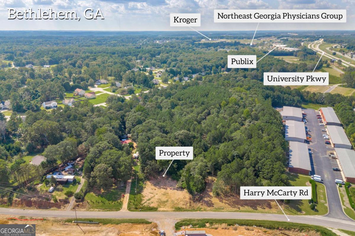 LOCATION LOCATION LOCATION!! .87 acre lot JUST off Hwy 316 near 316 Business Park in Bethlehem. Convenient to shopping/dining/theaters - less than 2 miles to Barrow Crossing Shopping Center (Target/Publix/etc) County water available.