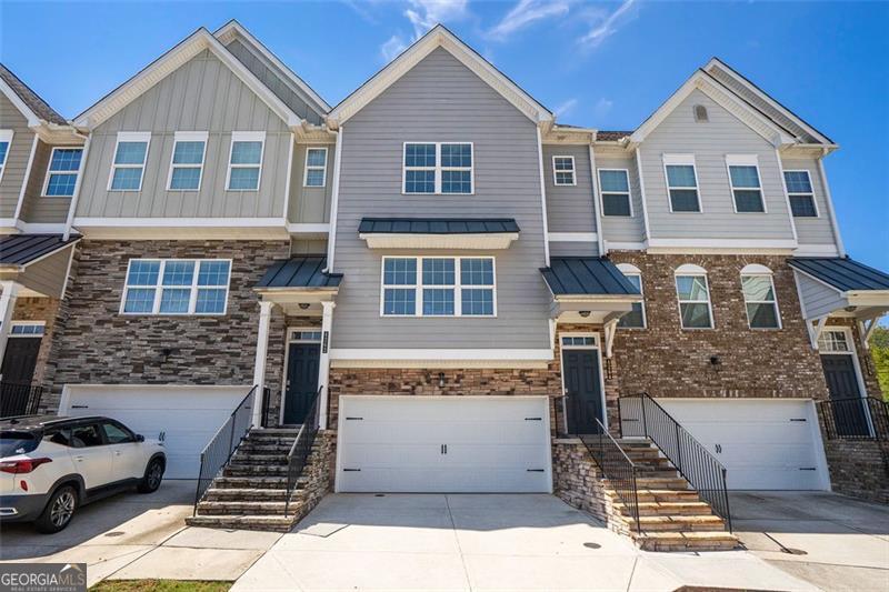 Welcome to this stunning 3-bedroom, 3.5-bathroom townhome in a gated, highly sought-after Buford community. Spanning three levels, this home features gorgeous hardwood floors, a grand foyer, and custom white cabinetry with an island and spacious pantry. Enjoy spacious bedrooms with walk-in closets and well-appointed bathrooms, plus a cozy, beautifully landscaped backyard. Located steps from premier dining and shopping, this move-in ready townhome offers privacy, security, and an open, entertaining-friendly layout in a vibrant, amenity-rich neighborhood. Schedule a tour to experience the lifestyle this property offers.
