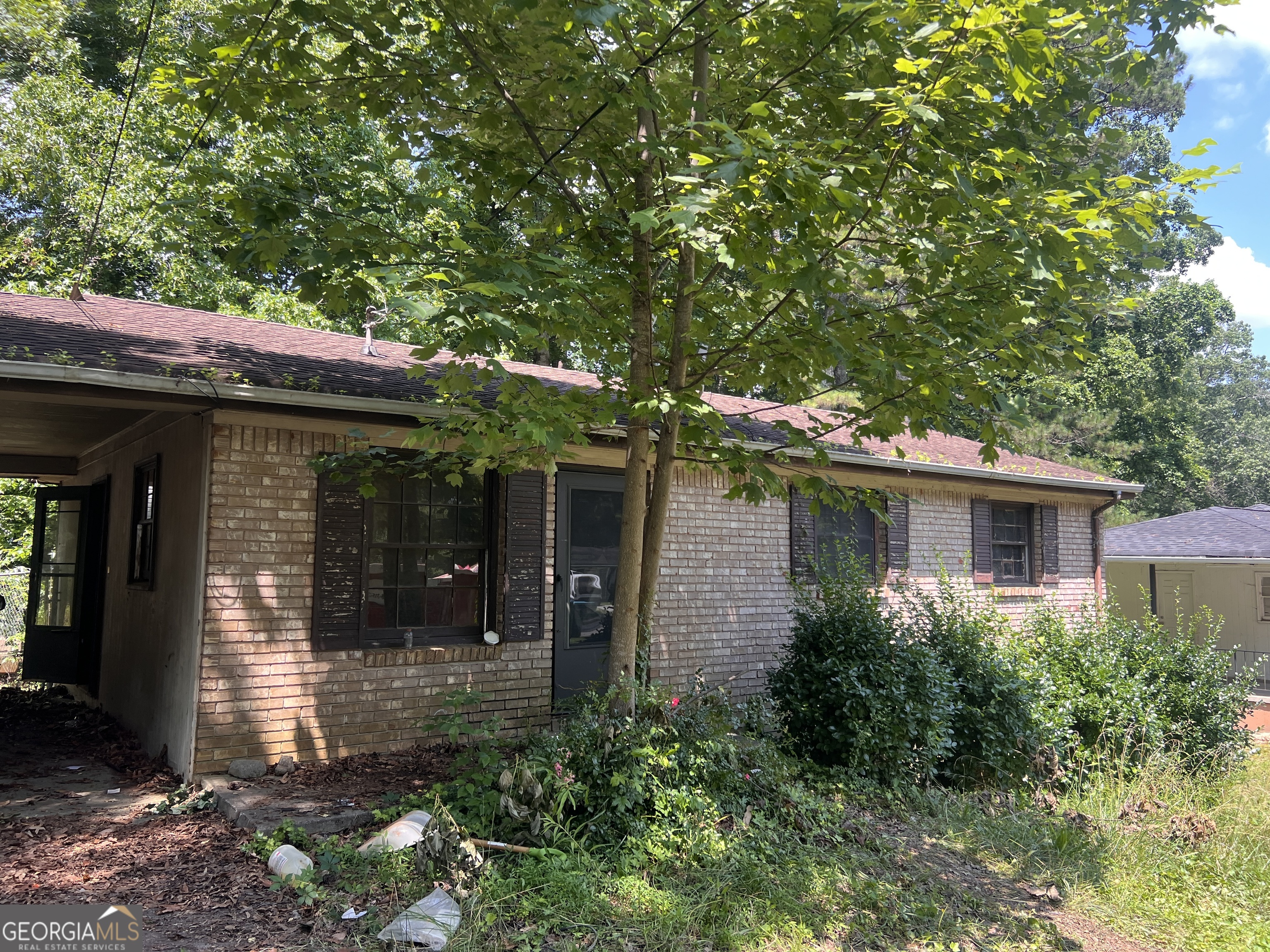 Fixer-Upper Opportunity in Cobb County! Attention savvy investors-this one-level ranch with a basement offers endless potential! Located in a desirable Cobb County school district, this home sits on a spacious and private lot with a large backyard, storage shed, and an additional outbuilding perfect for continued renovations or expansion. Bring your vision and transform this property into a stunning residence or income-producing asset. Don't miss out on this prime investment opportunity!