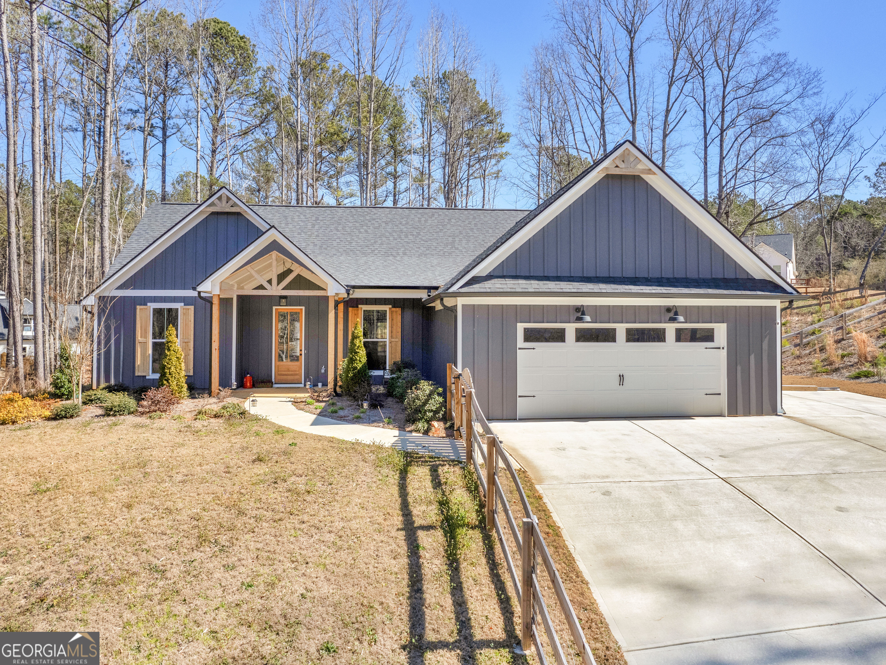 Three year old new construction home!1 Three bedrooms and two full baths plus powder room! open floor plan with large great room that features 10 ft ceilings and a rock fireplace, built in bookcases and shiplap accents. Engineered hardwood flooring in main area of home! Tile flooring in the laundry and full baths. Carpet with upgraded pad in the three bedrooms. Covered back porch with access to master suites and comes standard with cable/ plug, perfect for outdoor entertaining area! Kitchen has a breakfast bar, granite tops, a tile back splash and under cabinet lighting! 42 Inch top cabinets with crown is also a standard feature. Plus a walk in pantry, oversized laundry room with laundry sink and a favorite feature- access to master closet! Master suite with tray ceiling, double vanity, oversized soaking tub, separate tile shower with frameless shower door! Split bedroom style home! Custom features include wood exterior doors, custom cedar shutters and cedar post and accents on the front porch! Upgraded trim package. Hardi plank exterior with a board and batten front. Garage door opener along with 2 remotes. Granite countertops in secondary baths, frames mirrors and comfort height toilets. All this situated on a 1.002 acre lot not in a subdivision so no HOA with this one! Plus, this home already has a fenced backyard, privacy fence.