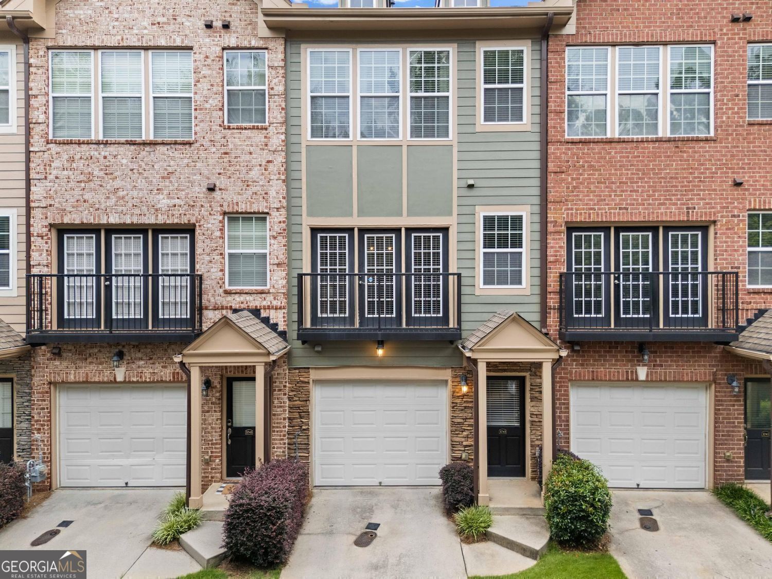 Welcome to this move-in-ready townhome in the sought-after Ashford Creek community in vibrant Brookhaven! Located towards the back of the community, with tree-lined views out every window, this spacious, light-filled home features modern updates, stylish finishes and a unique Juliette balcony too! Enjoy beautiful hardwood floors throughout, plus updated lighting, a stylish kitchen and a newer roof and systems. Retreat to the spacious, upper-level primary suite, which includes a spa-like bathroom and a spacious closet. The laundry room completes this level. On the lower level you will find a 1 car garage and a flex space with a half bathroom, perfect for an office, gym, or even a guest room. Ashford Creek is a friendly community with an active HOA, with fabulous amenities and low fees! Residents enjoy access to a fitness center, resort-like pool, community lake, gazebo, sidewalks, secure access gate, and clubhouse, fostering a social and welcoming atmosphere. Located steps away from Blackburn Park, the new PUBLIX in the revitalized Cambridge Square shopping center, restaurants, schools and the YMCA. Just across the street is Blackburn Park, with many events throughout the year. You will also enjoy easy access to major highways, medical facilities and the Perimeter Center business district. Schedule your showing today and experience all this fabulous community has to offer!