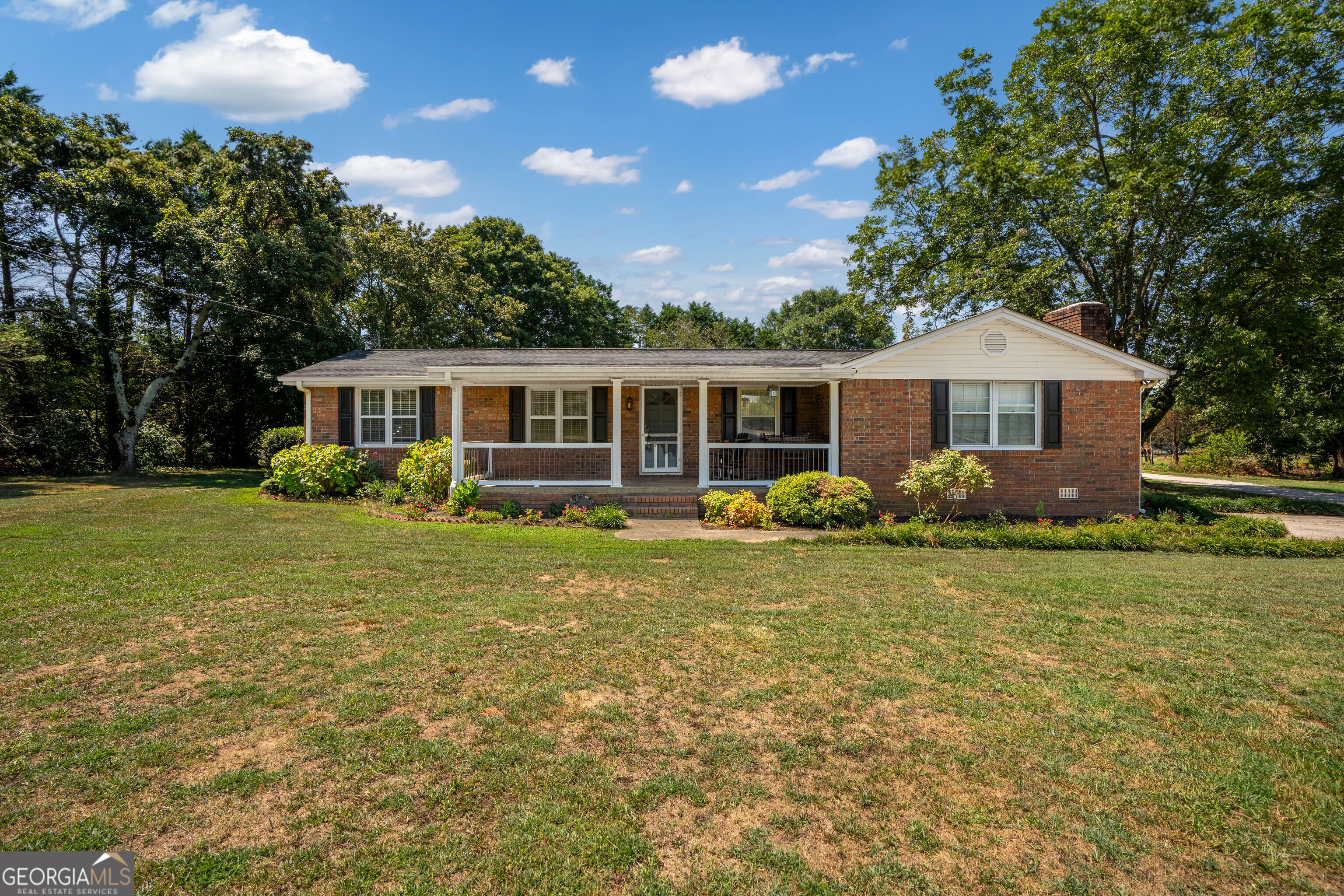 Location...Convenient to shopping at the Tanger Outlets, easy distance to Interstate 85 and the SK Battery America Plant plus more. Beautiful large flat yards (front and back), 4-sided brick with large front porch to relax on after a long day of work. Are to just name a few features that will make you want this one for your new home. It features 4 bedrooms with 2 full baths. This home has just enough room for all the entertaining that you will want to do. The large country kitchen with the dining area that is open to the living room. . Some of the updated features are HVAC, water heater, field lines, roof, freshly painted interior, new LVT flooring throughout, new countertops in the kitchen and backsplash and Master bath and Master bath . Walk out back to your secluded large flat back yard. Need more storage we got that too.... Shed with lot of space. All on over acre lot. Come see it for yourself!!!