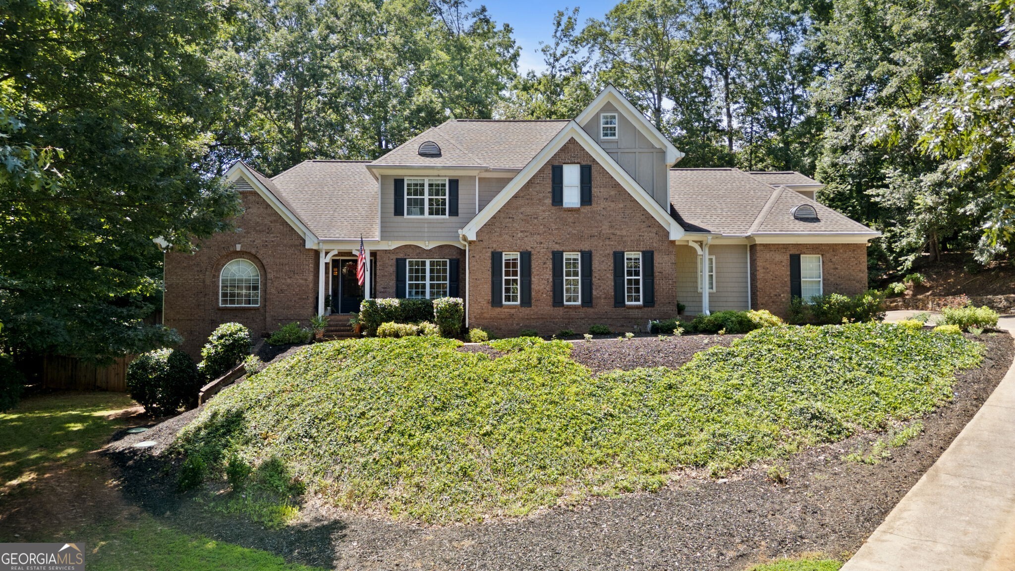 Designed with Family, Friends, and Fun in Mind tucked away on a private.68 acre homesite in the sought-after Chattahoochee Country Club area, this beautifully updated home offers the space, style, and flexibility today's modern families crave. Whether you're hosting game day gatherings or quiet family nights, the thoughtful floorplan provides endless options for how you live, work, and entertain. The heart of this home is the beautiful and efficient Kitchen that offers two large islands, stainless appliances, quartz countertops and tons of countertop prep space that flows seamlessly to the fireside Great Room -Need a formal dining space or home office? A flexible room just off the kitchen provides the perfect solution. Step outside to the covered back porch-complete with fireplace, grilling area, and even a putting green-ideal for football Sundays, family cookouts, and unwinding while overlooking the private backyard. The primary ensuite is located on the Main Level and has an adjoining spa bath. Upstairs, you'll find two spacious guest bedrooms, a bonus room, and a full bath-perfect for kids, guests, or extra office space. The finished terrace level offers newly updated with LVP flooring and fresh paint, features a large family room, game area, bedroom, full bath, plus a workshop and additional storage. The private homesite has space for gardening, playsets or jump on your golf cart for a quick ride to the neighborhood lake - Lake Knickerbocker perfect for fishing or a kayaking . Just down the street from Chattahoochee Country Club where resort-style amenities include a full-service marina & boat slip, waterfront clubhouse w/dining, swimming pools, tennis and pickleball courts, fitness center, walking trails, and membership opportunities at Chattahoochee Golf Club. If you've been searching for the whole package-home, lifestyle, and location-this one delivers.
