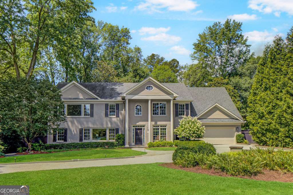 Exceptionally well-maintained home in highly desirable Chastain Park. This beautiful traditional home offers a very flexible floor plan with 4-6 bedrooms plus a main level office and additional flex space. The main level features a fireside family room with a picture window view and French door access to the beautifully landscaped, level and fenced backyard; kitchen equipped with stainless steel appliances, granite counters, and abundant custom cabinets, many including pull out shelving/drawers; light and bright dining room; spacious office; and an oversized bedroom/in-law suite/additional living space that includes a full bathroom with updated vanity and newly tiled shower as well as a huge walk-in closet. Front and rear stairs lead to the second level, where you'll find 2-3 secondary bedrooms plus an additional room and a shared bath- the combination of rooms could house a playroom, hobby room, or second office depending on your needs. Retreat to the primary suite featuring a generous bedroom overlooking the golf course; his and her walk-in closets with plentiful custom shelving; and a luxurious bath with separate shower and soaking tub, dual vanities and a constant heated floor for your comfort. The laundry room is conveniently located upstairs. You will love the views front and back from this home. Several windows are tinted to minimize glare and assist with energy savings. There are remote control blinds in the family room; new hardwood flooring throughout the upstairs and in the main level bedroom; refinished hardwood flooring on the main level; fresh paint throughout the interior and garage; and very good closet space throughout. Enjoy the Trex deck with water feature, rear flagstone patio, plus charming gazebo in the front yard. The water heater, garage door, gutters and downspouts, electrical panel, front shutters and columns, and landscape lighting have all recently been replaced. The front and back yards have been professionally landscaped/hardscaped. All of this, plus Chastain Park and all of its amenities in your front yard. Experience all Chastain Park has to offer - trails, golf, NYO baseball, award-winning playground, swimming pool and swim team, tennis, arts festivals, Synovus amphitheater, horse park, The Chastain restaurant, plus be among the first to enjoy the park's expansion featuring 40+ acres of new green space.