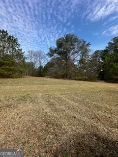 Beautiful 8.98 acre tract of gently rolling pasture land. This property is perfect for a residential development or farm land. It's a rare find and a must see!