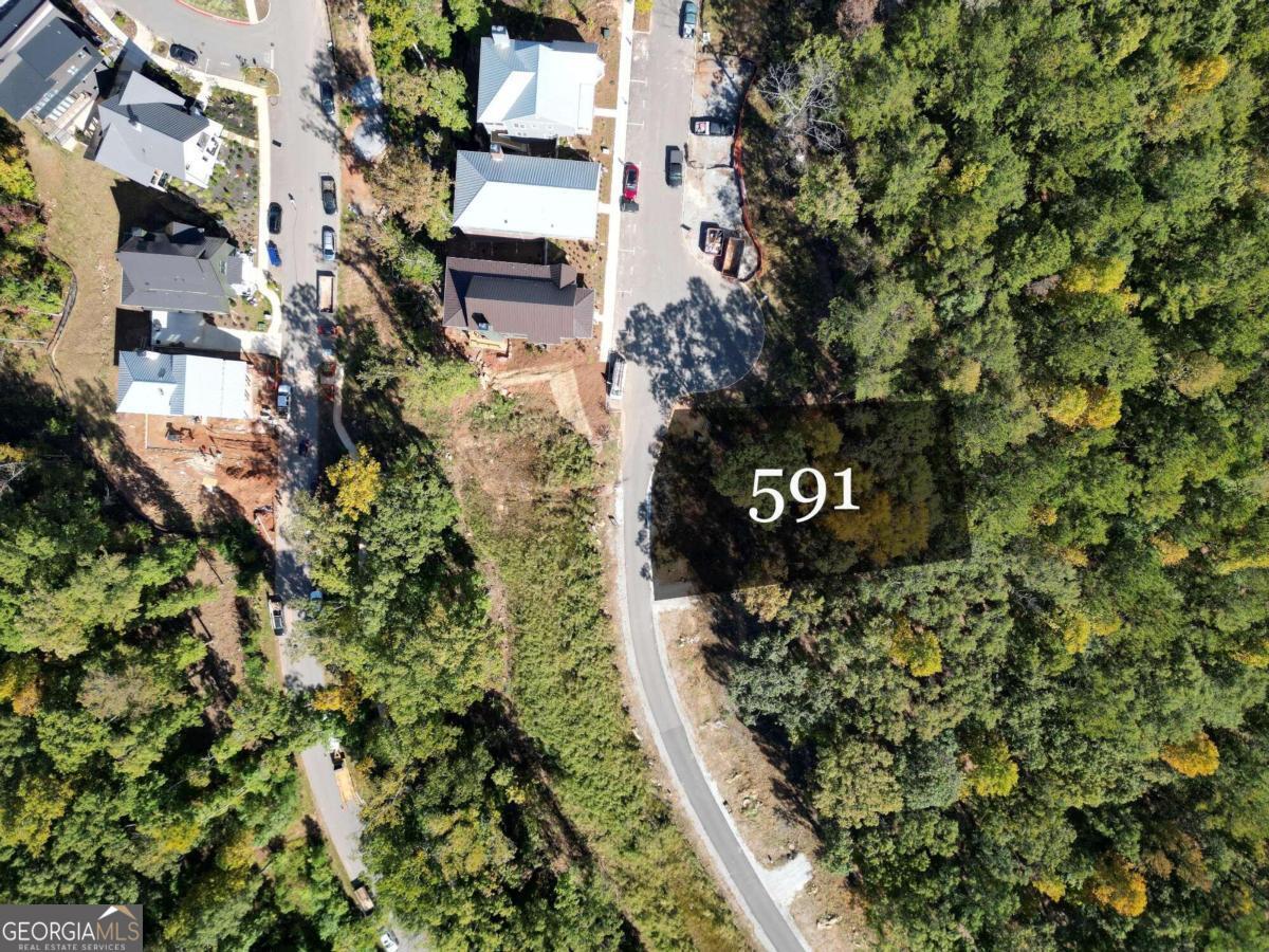 Come build your dream home on this 0.20-acre estate lot in the pocket neighborhood, Lupo Loop. Lupo Loop sits between Mado and Grange and offers spectacular treetop + sunset views from your custom built front porch. A short distance to all of Serenbe's amenities including the Spa, Gym, Restaurants and over 15 miles of protected nature trails. End lot with privacy green buffer, making sure you enjoy protected forest views for years to come.