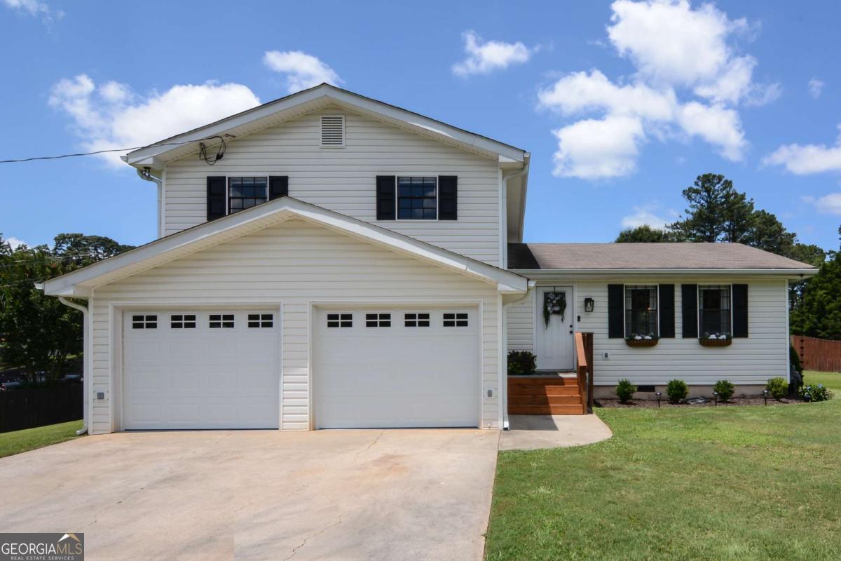 Location, location, location! Very near thriving Downtown Woodstock. Convenient for shopping, entertainment, I-575 and Hwy. 92. Flowing open floor plan with lots of entertaining space and a chef's kitchen featuring custom solid wood cabinets, gleaming premium granite countertops and stainless appliances. This beautifully decorated home will wow you from the moment you enter. The spacious sunroom that overlooks the large, level backyard will become your favorite retreat! New HVAC unit and epoxy garage floors and much more!