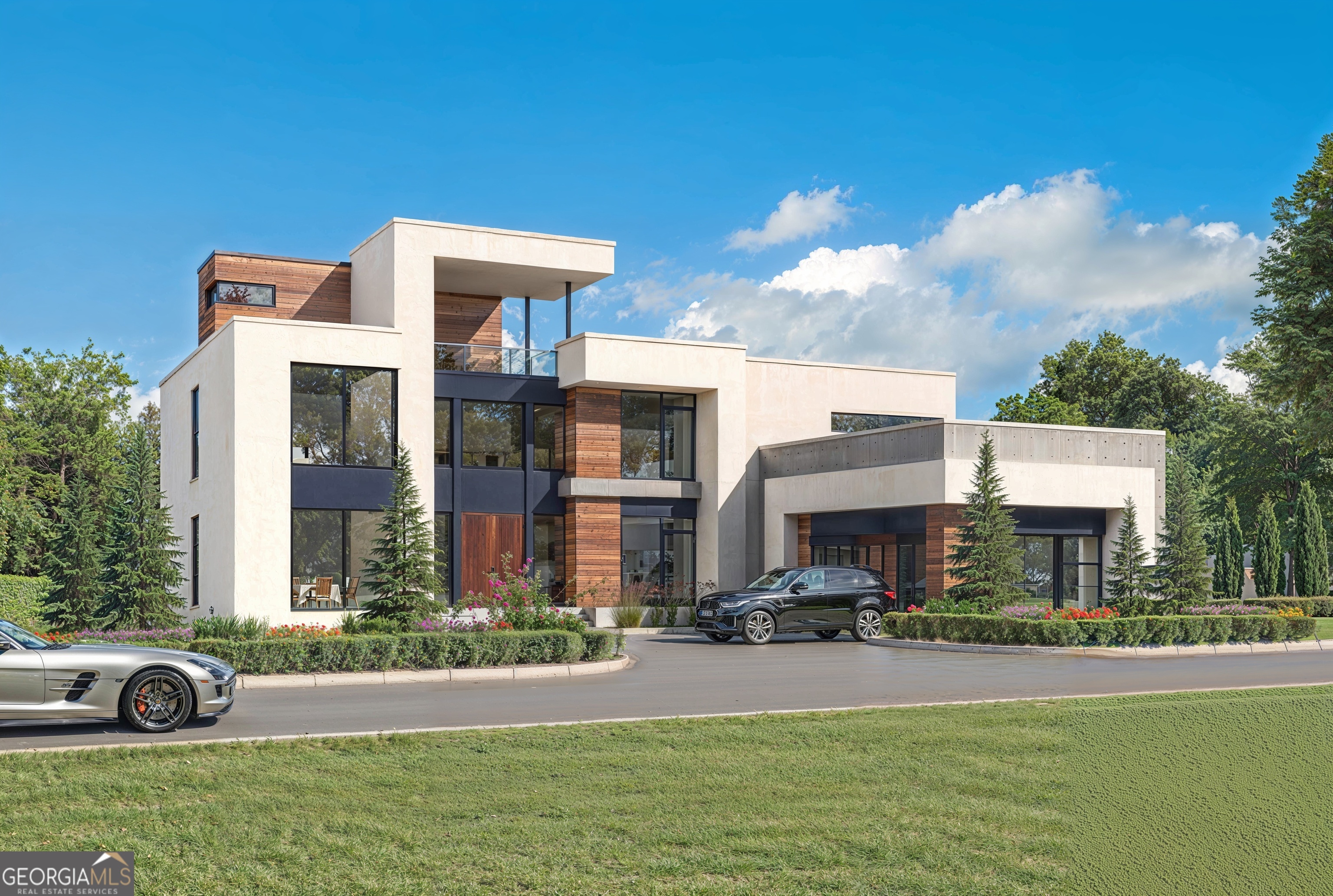 Introducing a rare opportunity to own a refined and modern transitional residence in the prestigious Le Chateau Estates Subdivision of Fairburn, GA, one of South Atlanta's most coveted gated communities, known for its modern European-inspired design and tranquil, natural surroundings. Scheduled for completion in Q1 2026, this striking 3,700 sq/ft modern transitional home is being meticulously crafted by renowned custom builder Boye Akinola of Boye Luxury Homes. Nestled on a pristine private lot, the home embodies the perfect blend of architectural elegance and serene living. Designed by award-winning architect Boye Akinola, the modified Gigi Plan boasts five spacious bedrooms and four and a half bathrooms, offering an ideal blend of style, functionality, and luxury. This thoughtfully curated home features premium finishes and top-tier design selections throughout. Step into an impressive open-concept layout, highlighted by soaring 20-foot ceilings in both the entry foyer and great room. Expansive California-style sliding glass doors create a seamless flow between indoor and outdoor spaces, perfect for both entertaining and everyday living. At the heart of the home lies a chef-inspired kitchen, featuring custom cabinetry, a stunning Quartz waterfall island, a walk-in pantry, and a bright, welcoming breakfast area. The main-level primary suite is a private sanctuary with unobstructed lake views and lush landscape vistas. It includes a generously sized walk-in closet and a spa-inspired bathroom adorned with sleek, contemporary finishes. Complementing the primary suite are three additional bedrooms, each designed with comfort and privacy in mind. All secondary bedrooms on the lower and upper levels feature en-suite bathrooms, making this home ideal for families or guests seeking personal space and convenience. The home's surroundings are equally exquisite, with professionally designed, lush landscaping that enhances privacy while seamlessly blending with the natural lakefront environment. The entire subdivision will feature pristine, manicured grounds, offering residents a heightened sense of exclusivity, comfort, and peaceful living. Additional features include: Energy-efficient insulated modem windows and exterior doors 10-foot ceilings on the main level Wide-plank hardwood flooring in all bedrooms Frameless glass showers Well-appointed laundry room with cabinetry and a wash sink Please Note: Rendered images may reflect optional upgrades, such as accent walls, floating vanities, and a future pool. The addition of a full basement and custom upgrades can be completed at an additional cost. Le Chateau Estates introduces the vibrant sophistication of Miami, Los Angeles, and Lagos to Atlanta, establishing the city's premier and only modern luxury residential community. For more information or to schedule a private consultation, please contact the listing agent.