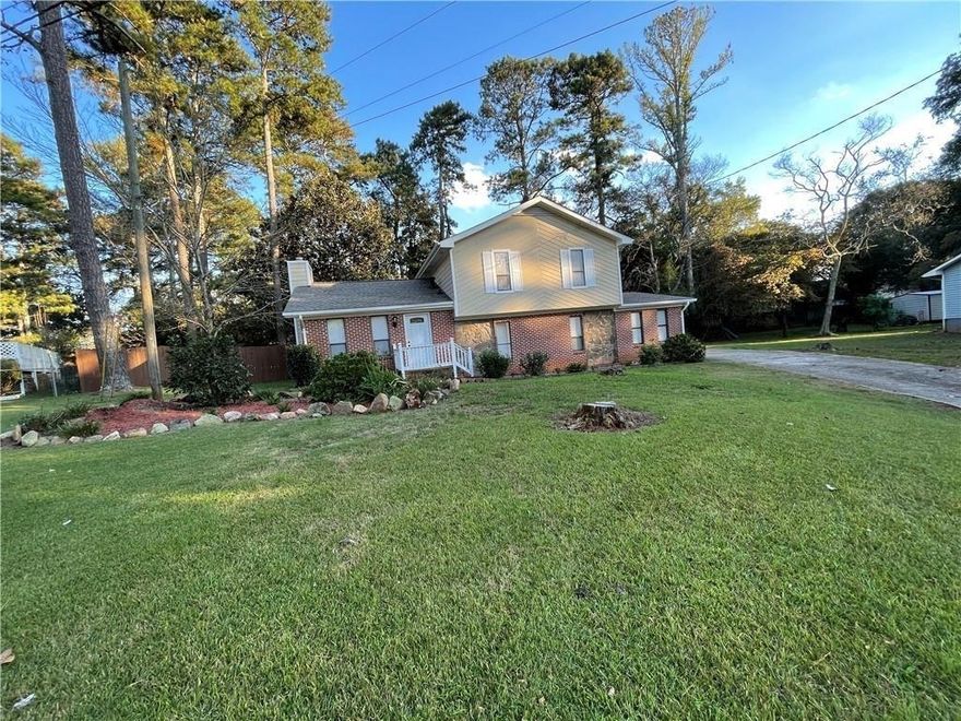 MOVE-IN READY!! This is a fantastic newly updated split-level home with 4 bedrooms and 3 full baths. It features a new roof, new carpet, new vinyl & laminate flooring, recently painted inside and outside. Leveled backyard and wood fencing. Large storage building in the backyard for all your storage needs. Excellent location with close proximity to Hwy 316, Northside Hospital, Schools, & Stores!
