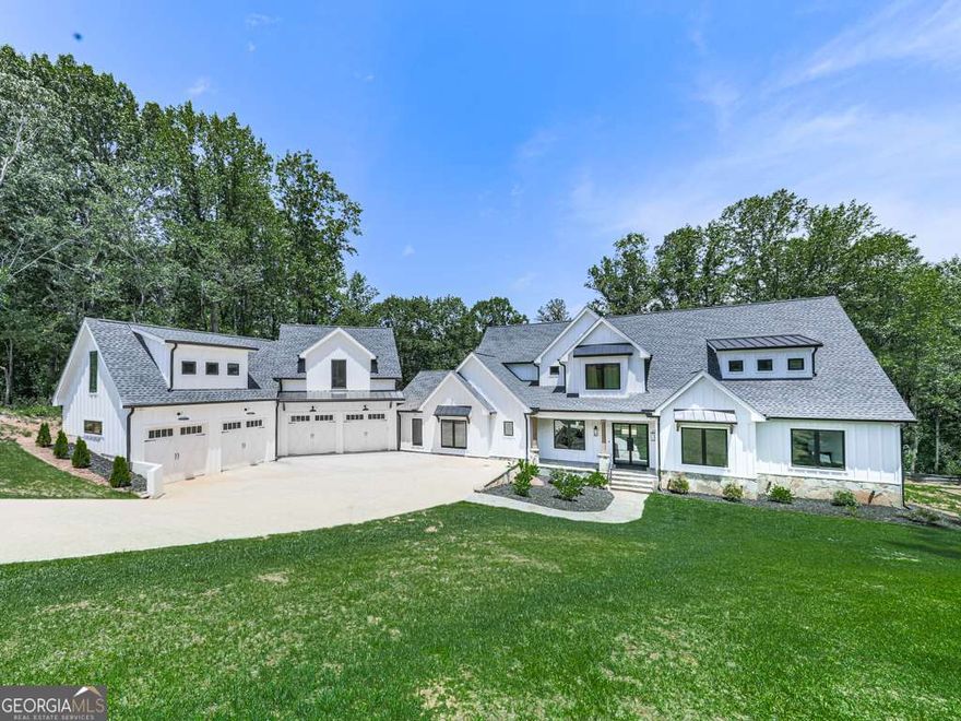 $10,000 IN CLOSING S COSTS OR RATE BUY DOWN! Welcome to your own slice of paradise! This exquisite custom modern farmhouse boasts a perfect blend of modern luxury and rustic charm. Step inside and be captivated by the soaring cathedral ceilings in the great room, featuring a cozy gas fireplace, Andersen stacking rear doors, and a built-in bookcase, all enhanced by a state-of-the-art SONOS sound system. Entertain effortlessly in the open-concept dining area with elegant built-in cabinetry, adjacent to a chef's dream kitchen equipped with a premium Thermador appliance package to include: 48" Refrigerator, 48" Freezer, 24" Wine Cooler, 48" Range with pot-filler, built-in Double Ovens, and built-in Microwave Oven, Coffee Maker and Elkay water dispenser in the pantry.  All of this and so much more! A spacious 12' island with bar-counter seating and additional storage, perfect for gatherings. A convenient butler's pantry and walk-in pantry adds extra storage for all your culinary needs. The main floor hosts a luxurious primary suite, complete with a custom bathroom featuring double vanities, a soaking tub, and an expansive 14ft wide walk-in 9 shower heads on each end, along with a beautifully crafted walk-in closet. Need space for work? This home offers two dedicated home offices, ensuring productivity in a serene setting. With 6 bedrooms, 4.5 baths, and charming guest quarters on the main level, there's room for everyone. The upper-floor boasts 4 spacious bedrooms, providing ample space for family and guests. Enjoy the convenience of a beautifully designed hall bath and a practical Jack and Jill bath connecting two of the bedrooms, perfect for shared living. Plus, with a second dedicated laundry room, managing household chores is a breeze.  Enjoy warm evenings on the oversized fireside deck, or take advantage of the recently finished 1000SF space above the detached 4-car garage-ideal for hobbies, a private studio, or future apartment. The unfinished basement is already 60% complete with HVAC, electrical, and insulation, ready for your personal touch. Plus, the generous backyard offers room for a pool, turning your outdoor dreams into reality. Explore every corner of this enchanting home from the comfort of your couch with our immersive 3D virtual tour, allowing you to envision life in this incredible space before you even set foot inside. Located in a friendly neighborhood with top-rated schools, parks, and convenient shopping nearby, this property is not just a house-it's a lifestyle. Don't miss this rare opportunity to own a remarkable property that perfectly balances luxury living with the comforts of home. Schedule a viewing today and make this farmhouse your forever sanctuary!