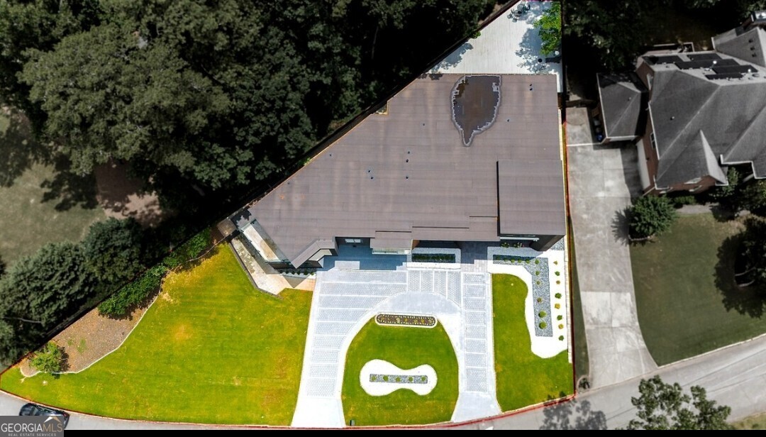 An expansively elegant Contemporary / Modern Home located in Atlanta. Look No Further than this one of a kind new construction beauty. This beautiful home features 20 foot ceilings, entering in through the pivot door, you step inside your 2 story foyer. The family room to your left and your oversized dining area to the right with seating for 12 people. The custom kitchen is one of a kind; two walk in pantries, waterfall island, & a direct view into the 2 story great room. The Main floor features an oversized Master with large walk in closets and a beautiful master bath. There is a secondary Master / In Law Suite on the main level accompanied by a half bath. The floating staircase with glass railing design will take you to the secondary level where you will find 5 bedrooms, 5 baths, a loft space with a Juliette balcony, and a laundry room. The entire home features natural lighting from floor to ceiling which creates a beautiful retreat for each room. This luxurious home offers great space for privacy or entertaining. This gorgeous home is centrally located within less than 25 minutes to downtown, fine dining establishments, and boutique shops, our home places you at the heart of the city's vibrant culture and lifestyle.