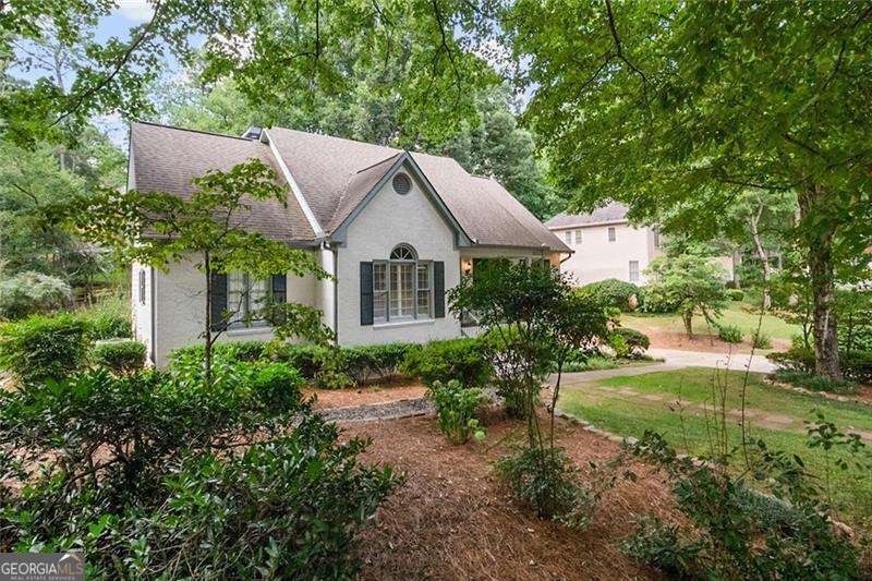 Welcome to 2838 Saddlebrook - where timeless charm meets modern convenience in one of East Cobb's most desirable swim/tennis communities. This beautifully updated limestone-wash home sits on a tree-lined street in the active Saddlebrook neighborhood, known for its clubhouse, pool, tennis courts, sidewalks, and top-rated schools. Enjoy a sun-filled interior featuring a spacious sunroom with walls of windows overlooking a professionally landscaped backyard. The kitchen is a dream-granite island, gas cooktop, LG refrigerator with dual icemakers, high-end faucet, new dishwasher and disposal, and a custom-built, floor-to-ceiling pantry for abundant storage. The main level also boasts a walk-in laundry room and a serene primary suite with upgraded sinks and finishes. Recent improvements include: New Hardie plank siding and trim New 10x10 back deck and 4' privacy fence Cedar bridge over stormwater drain New exterior insulated doors, flood lights, and lighting fixtures All new toilets, upgraded plumbing (PVC to CPVC) New water heater (2024) Electrical upgrades with GFCIs and added outlets Chimney cap, attic insulation replacement, and alarm system HVAC under service contract, termite, pest, and critter plans in place and transferrable The backyard has been extensively graded, several hazard trees removed, and lush landscaping added for beauty and function. With exceptional curb appeal, thoughtful interior upgrades, and a vibrant community setting, this home is truly move-in ready and waiting to welcome you home.
