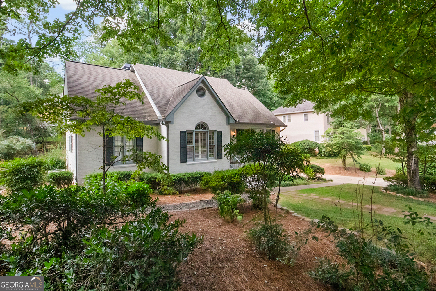 Welcome to 2838 Saddlebrook - where timeless character blends seamlessly with modern updates in one of West Cobb's most sought-after swim/tennis neighborhoods. Tucked along a picturesque, tree-lined street in the vibrant Saddlebrook community, this beautifully updated limestone-wash home offers both charm and convenience. Residents enjoy access to a clubhouse, pool, tennis courts, sidewalks, and top-rated schools. The neighborhood is also home to a well-established, award-winning swim team that fosters both competitive spirit and strong community ties. Inside, you'll find a bright and inviting layout, featuring a spacious sunroom with walls of windows overlooking the professionally landscaped backyard. The renovated kitchen is a standout, boasting a granite island, gas cooktop, LG refrigerator with dual ice makers, high-end faucet, new dishwasher and disposal, and a custom-built, floor-to-ceiling pantry offering generous storage. The main level includes a walk-in laundry room and a serene primary suite with upgraded sinks and finishes. Recent improvements include: * New Hardie Plank siding and trim * New 10x10 back deck and 4' privacy fence * Cedar bridge over stormwater drain * New exterior insulated doors, floodlights, and lighting fixtures * All new toilets and upgraded plumbing (PVC to CPVC) * New water heater (2024) * Electrical upgrades with GFCIs and added outlets * Chimney cap, attic insulation replacement, and alarm system * HVAC under active service contract * Termite, pest, and critter control plans in place and transferrable The backyard has been extensively regraded with hazardous trees removed and lush landscaping added for both beauty and function. With exceptional curb appeal, meaningful updates throughout, and a warm, active community, this home is truly move-in ready and waiting to welcome you.