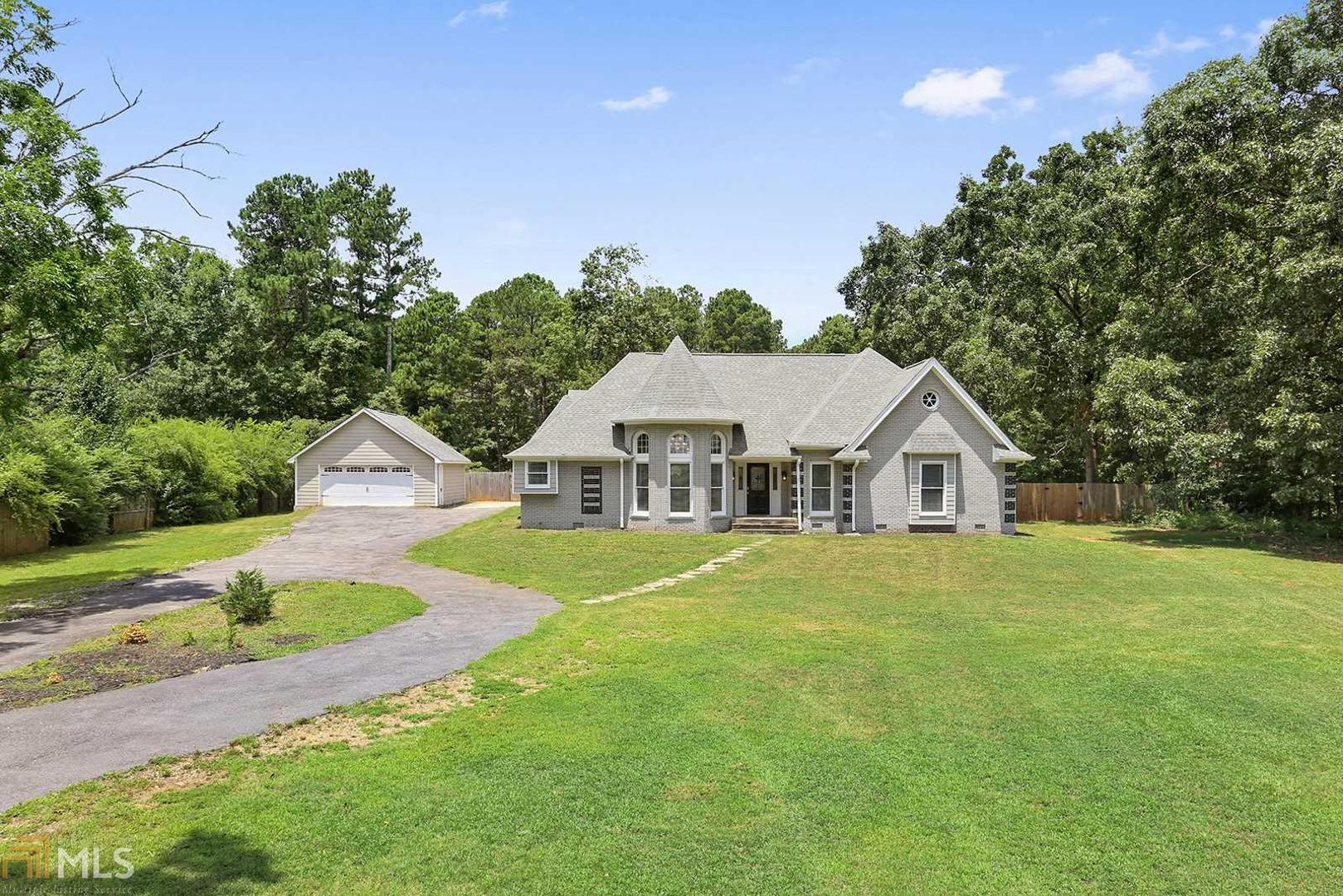 This spectacular statement home on a HUGE lot offers unique details & custom features in an open, bright & sophisticated layout. Master craftsmanship & quality materials are evident throughout. Boasting many distinctive details, this home features; custom finished HW flooring, 10ft+ ceilings, an abundance of custom built-ins, decorative chandeliers & fixtures, all updated baths, decorator paint colors, & an extensive trims & moldings package. As you enter the grand Foyer you are greeted w/ an open airy floor plan that offers graciously sized Formal rooms including; turret designed Dining Room, over sized vaulted ceiling Great Room appointed w/ a handsome masonry fireplace that command the room, cozy family room, & a gourmet Kitchen.