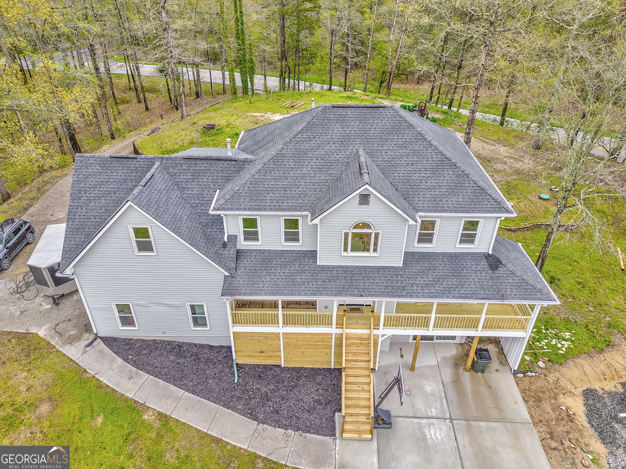 Beautiful 3 story home on 8 plus acres in the heart of Paulding County with a barn! This home offers the perfect blend of privacy, comfort, and room to roam. Whether you're looking for a peaceful countryside escape or a space to entertain and enjoy the outdoors, this one checks all the boxes! Step inside the home to discover a floor plan that features multiple level living areas, generous bedrooms and ample natural light throughout. The main level boasts of a welcoming living room, a well appointed kitchen and a spacious dining area off from the foyer. The main level also has an expansive front porch that is ideal for morning coffee or sunset views. Upstairs, you'll find cozy bedrooms and a primary suite with serene views and a private bath. The finished lower level adds even more living space, perfect for a home office, media room, guest suite or game room- let your heart guide you! Outside, the possibilities are many! With over 8 acres of beautiful land, there's room for gardens, trails, or even your own mini farm/homestead. Enjoy the peace of country living while still being within easy reach of town amenities.