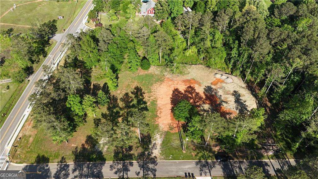 Looking for the perfect lot to bring your house plans to life? Here it is! This level corner lot on New Hope Church Rd and Oak Farm Rd. is absolutely beautiful and in a great location! This lot is a must see!